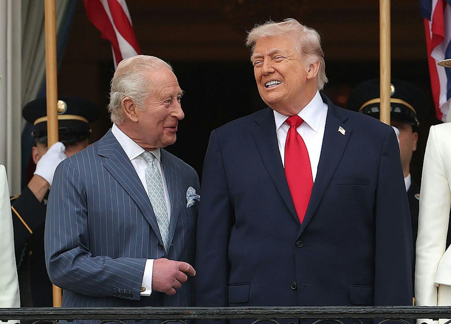 King Charles III and U.S. President Donald Trump talk as they stand on the balcony of the White House during a state arrival ceremony on the South Lawn of the White House on April 28, 2026