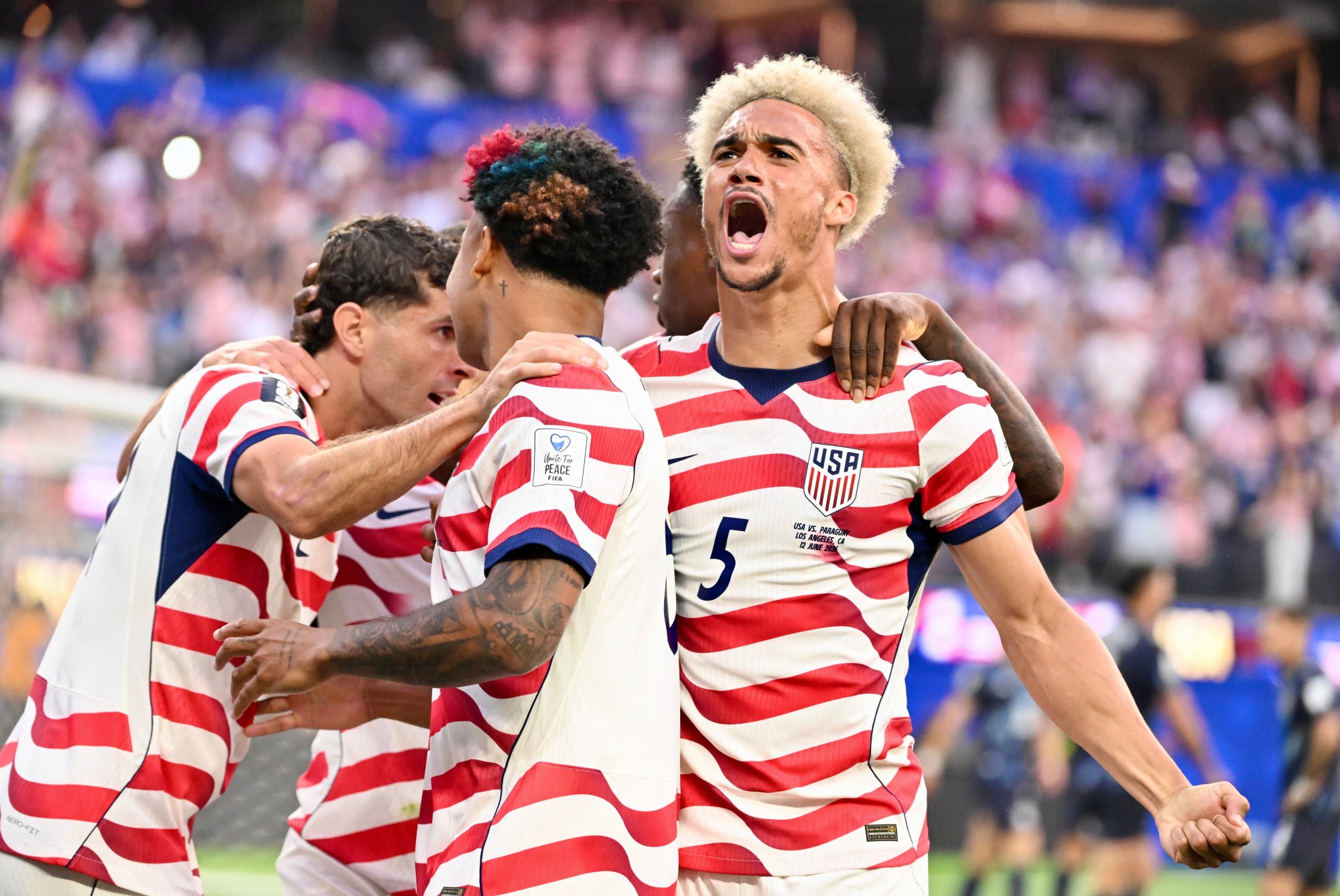 United States defender Antonee Robinson (5) reacts after a goal...