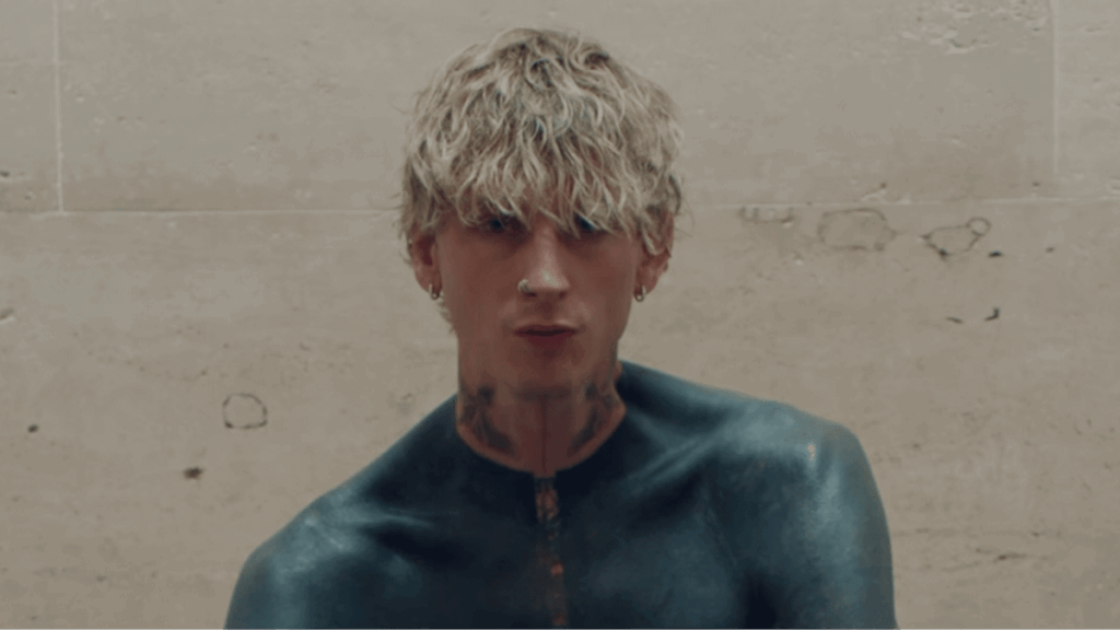 Machine Gun Kelly reveals terrifying side effect of 'dark mode' tattoo which covers his entire upper half