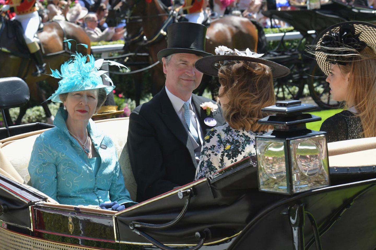 Princess Anne, Princess Royal, Vice Admiral Sir Tim Laurence, Princess Eugenie of York and Princess Beatrice of York arrive in the Royal procession on day 3 of Royal Ascot at Ascot Racecourse