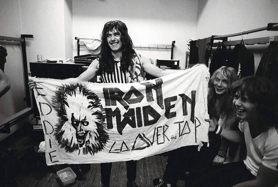 Steve Harris backstage with an Eddie flag
