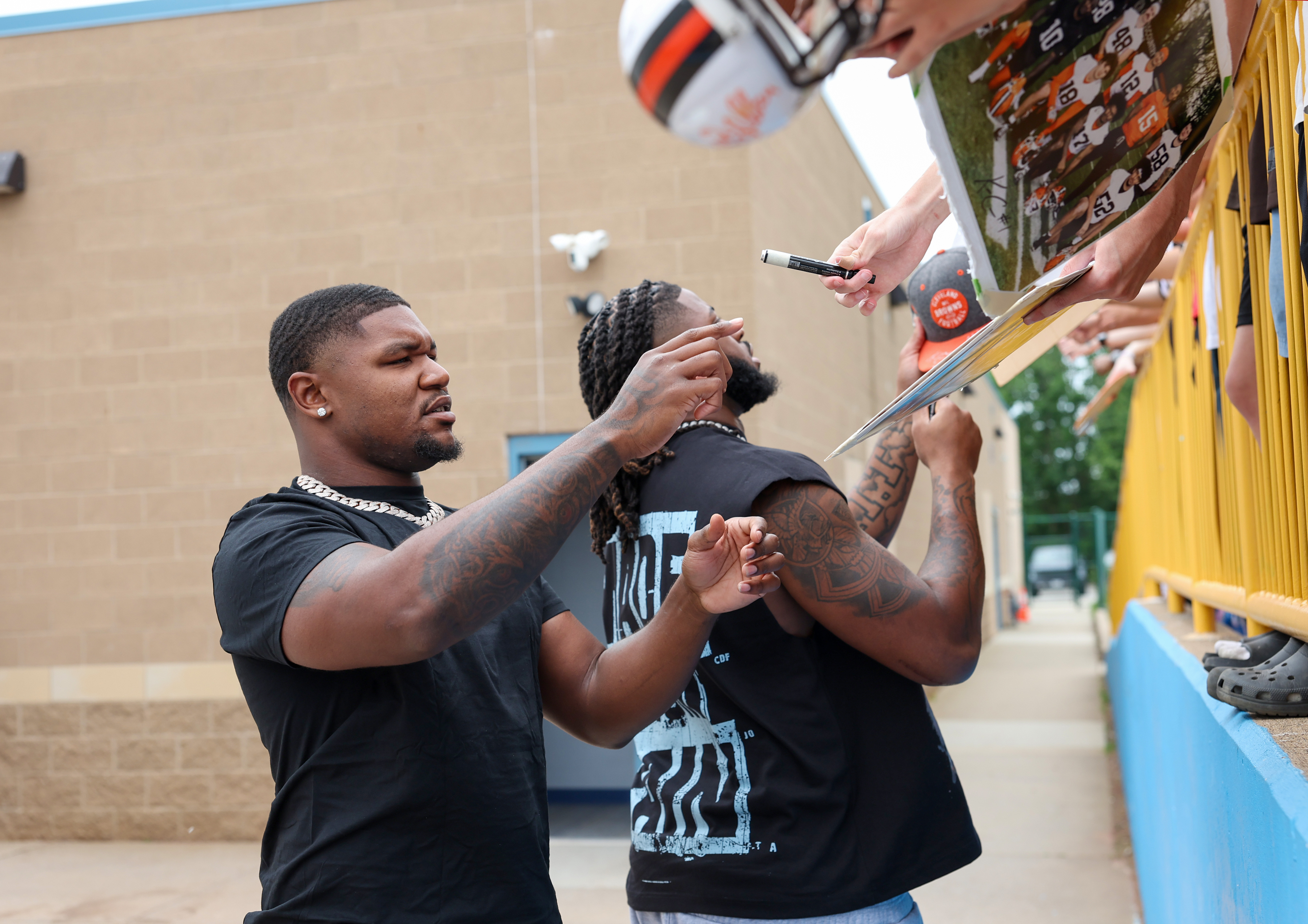 Photos from the Denzel Ward celebrity softball game, June 6,...