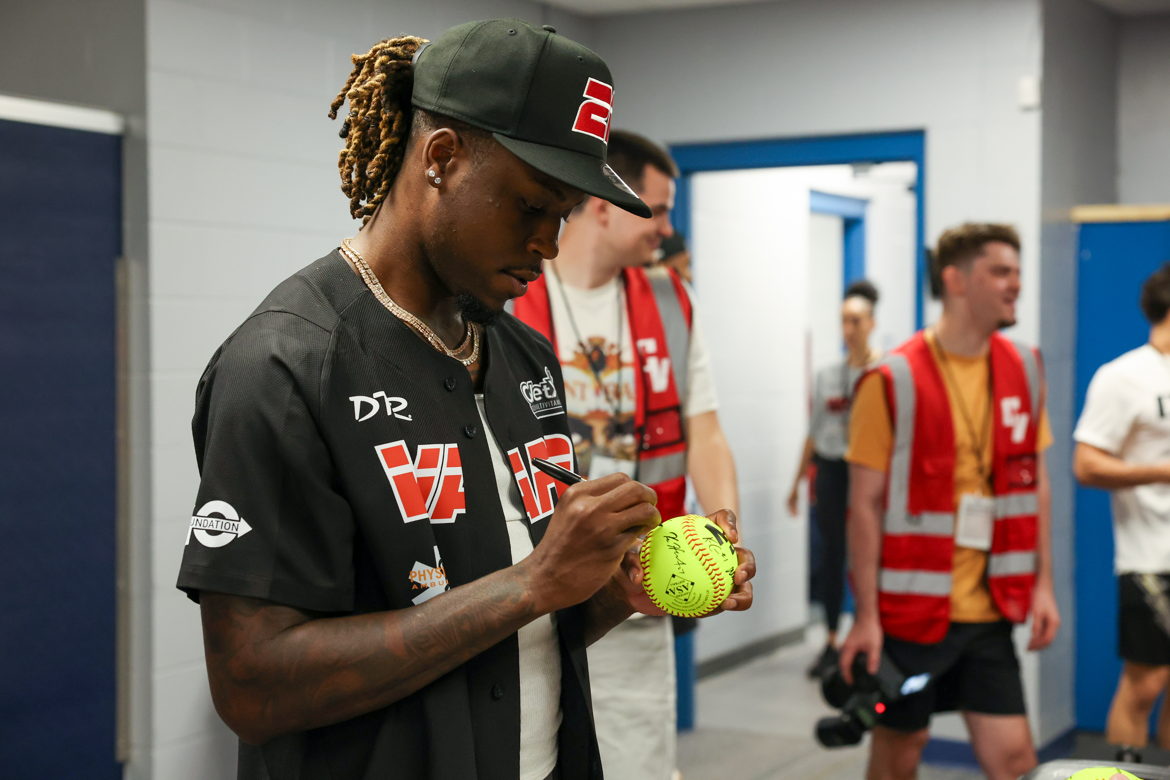 Photos from the Denzel Ward celebrity softball game, June 6,...