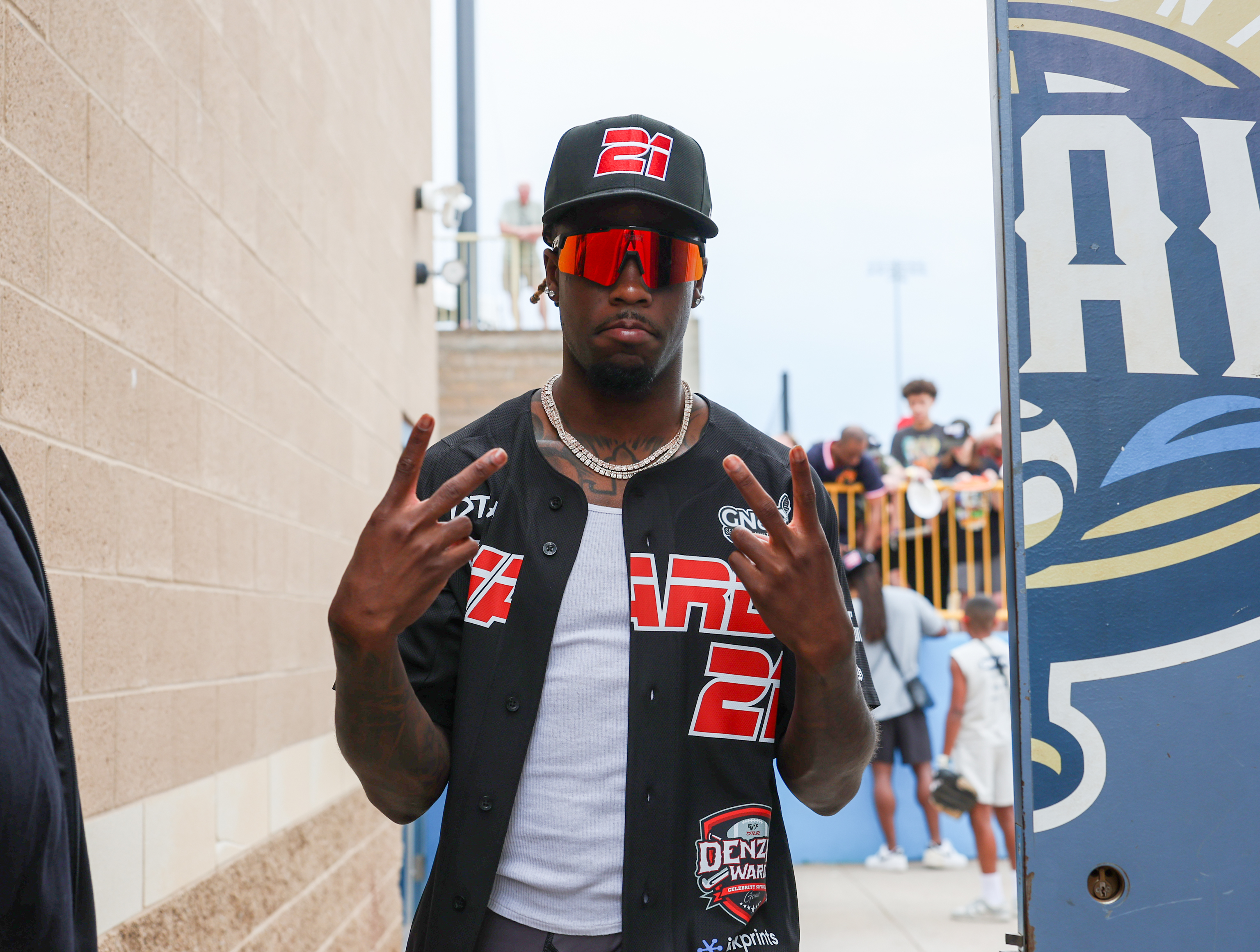 Photos from the Denzel Ward celebrity softball game, June 6,...