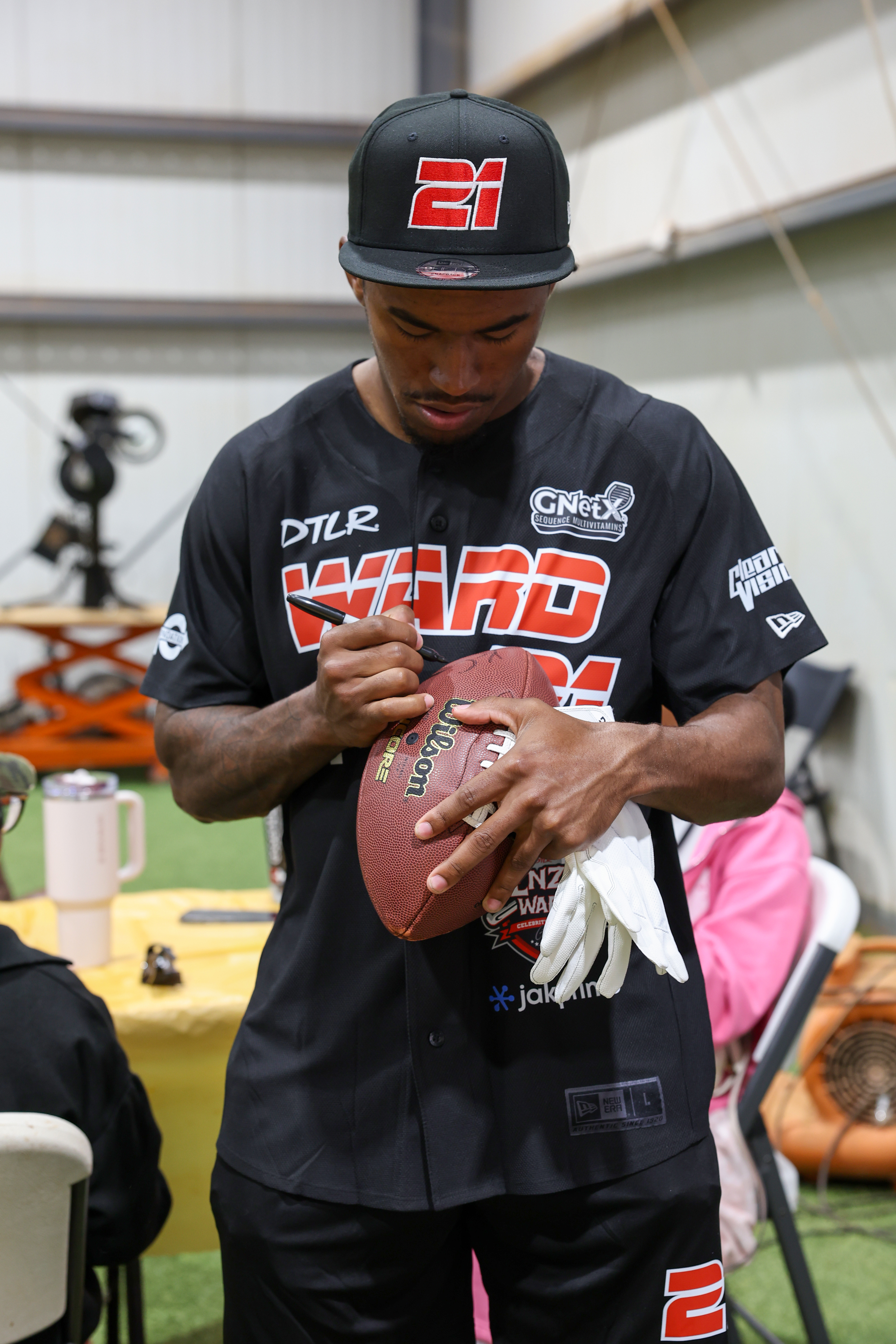Photos from the Denzel Ward celebrity softball game, June 6,...