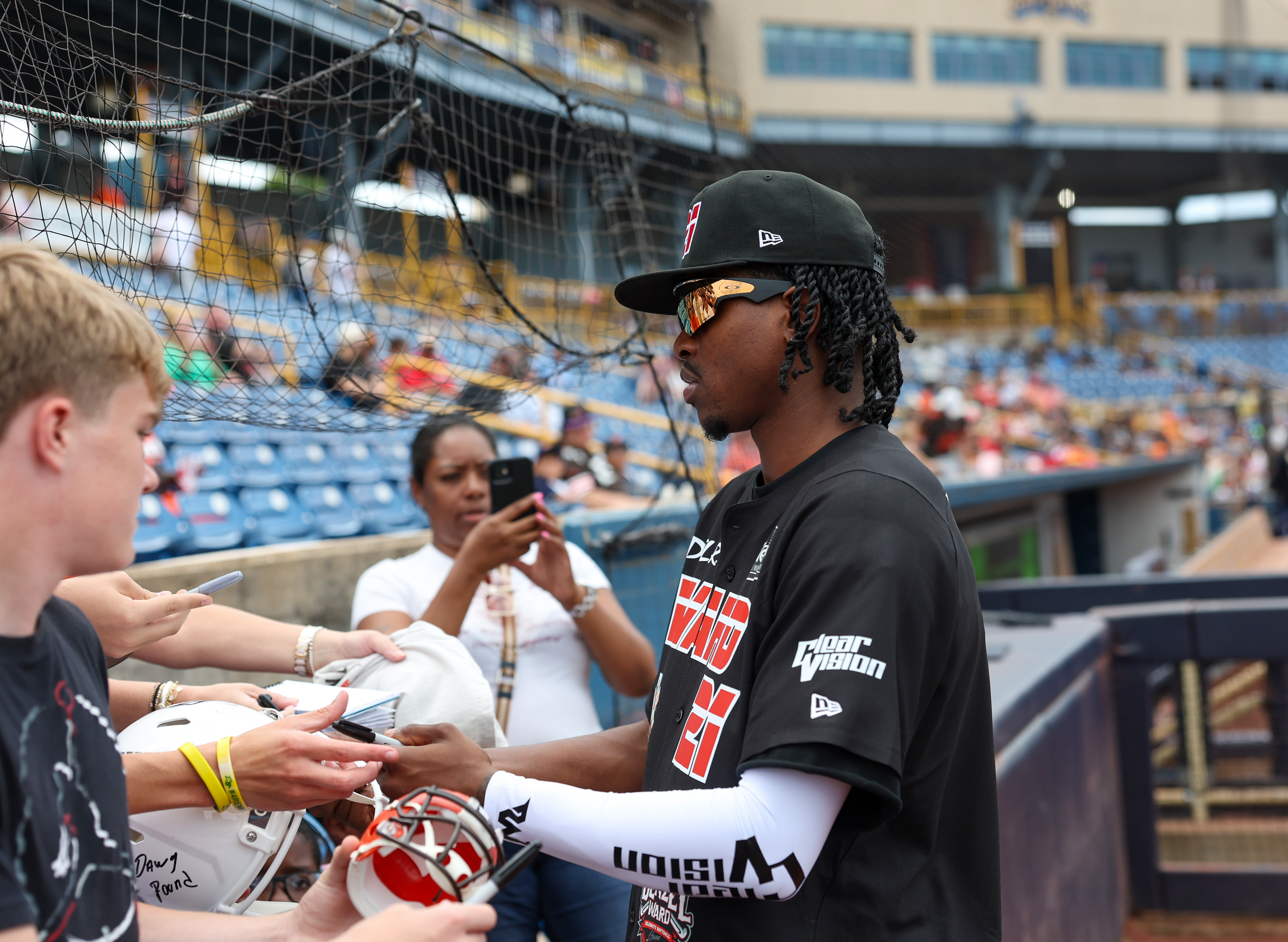 Photos from the Denzel Ward celebrity softball game, June 6,...
