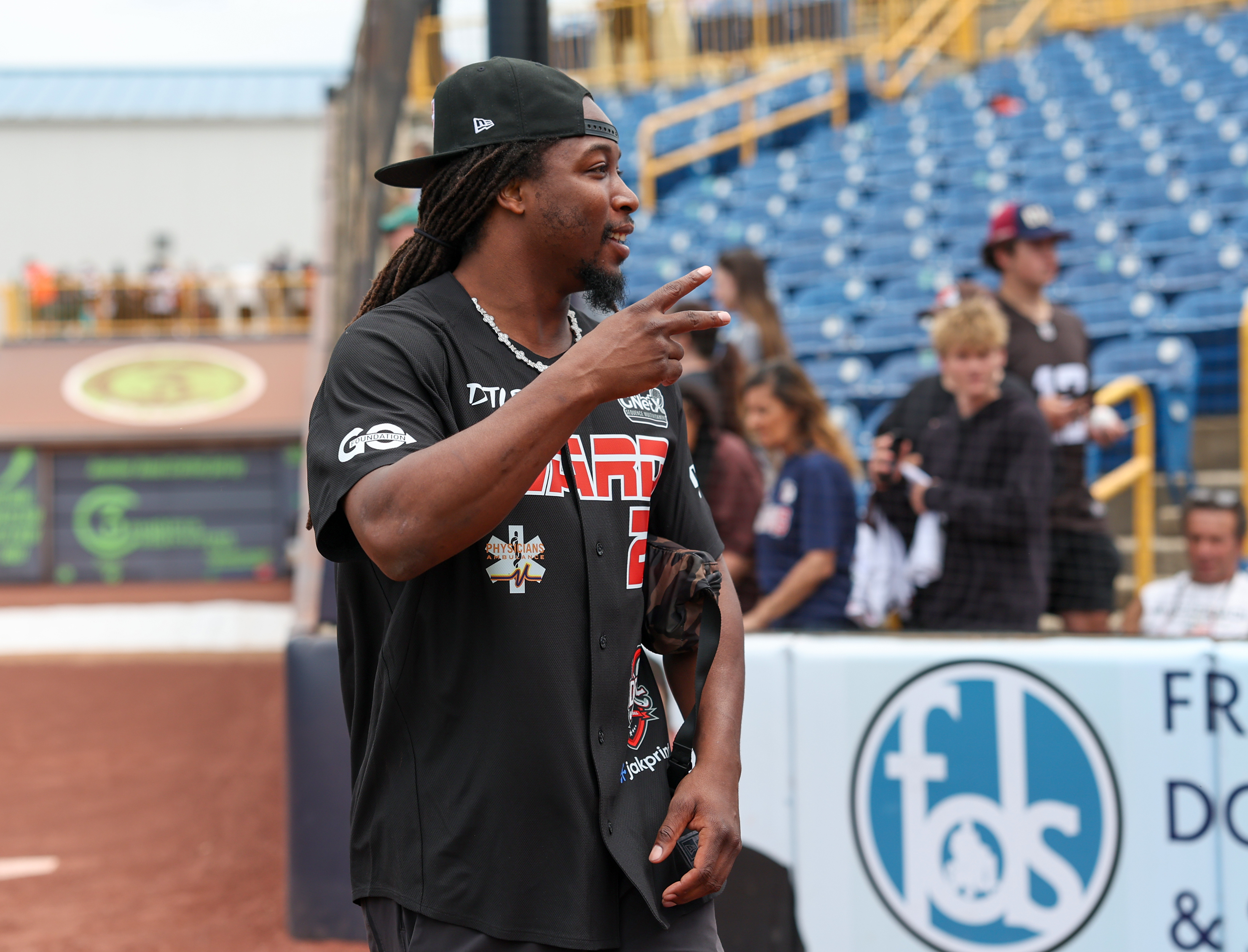 Photos from the Denzel Ward celebrity softball game, June 6,...
