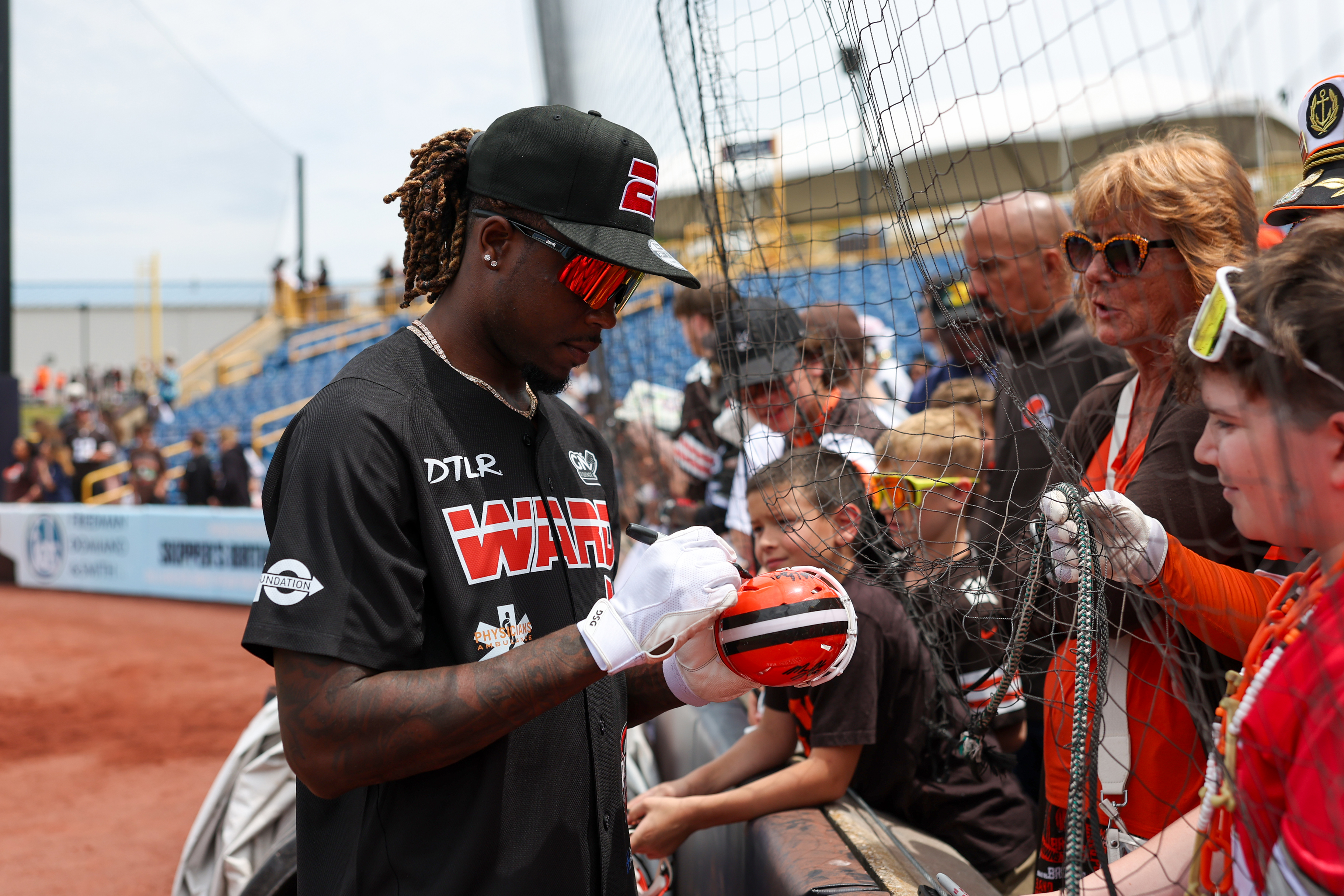 Photos from the Denzel Ward celebrity softball game, June 6,...