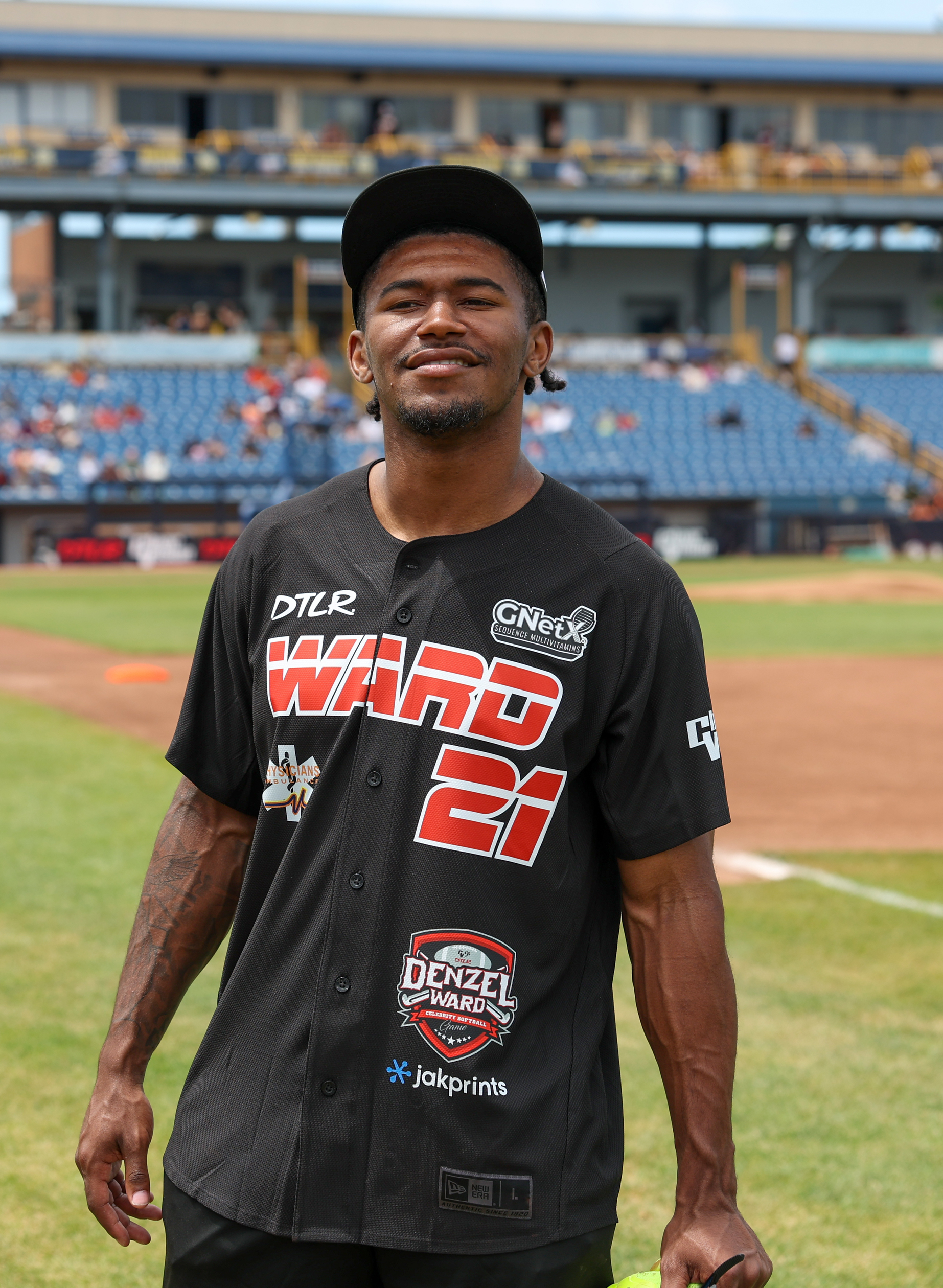Photos from the Denzel Ward celebrity softball game, June 6,...