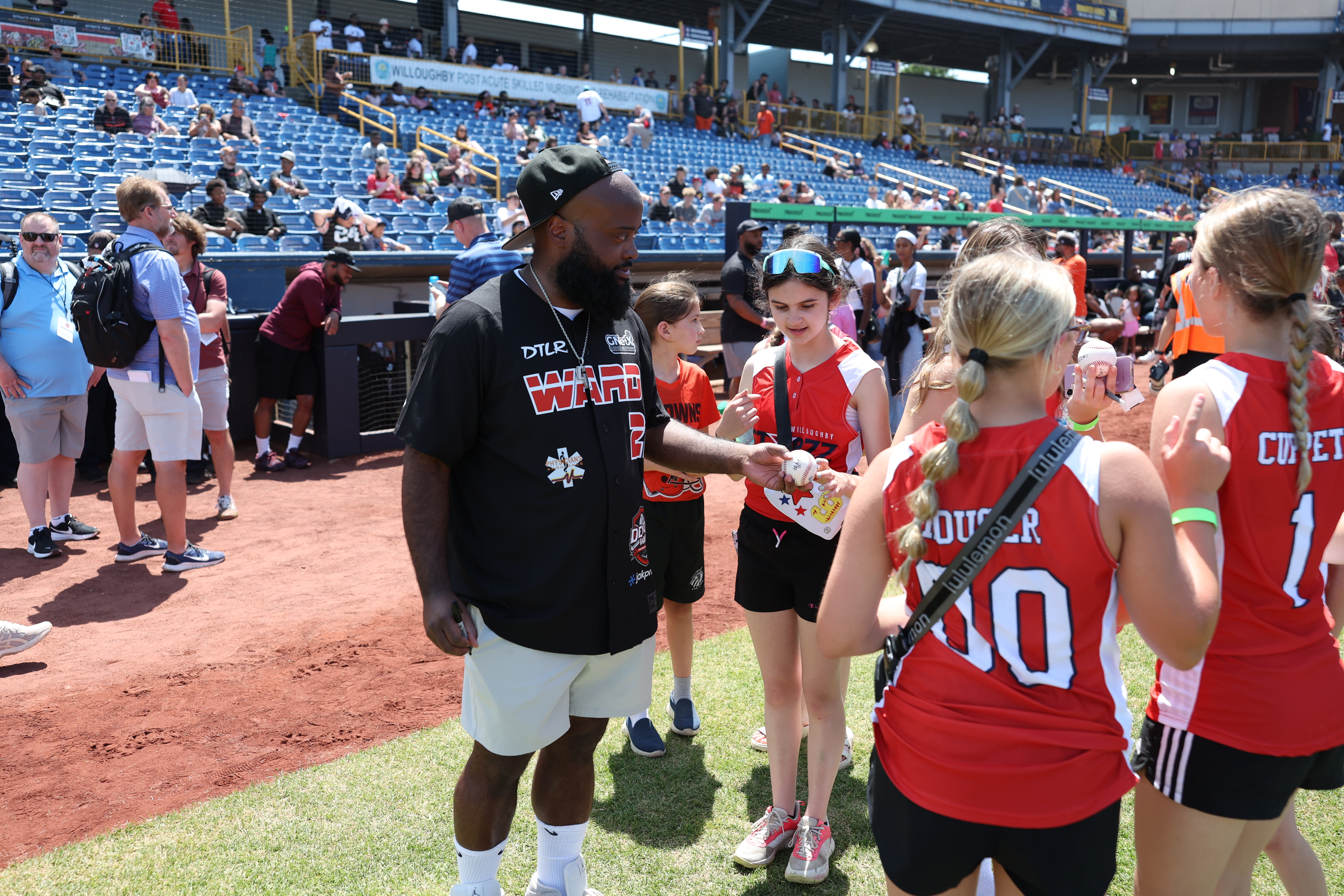 Photos from the Denzel Ward celebrity softball game, June 6,...