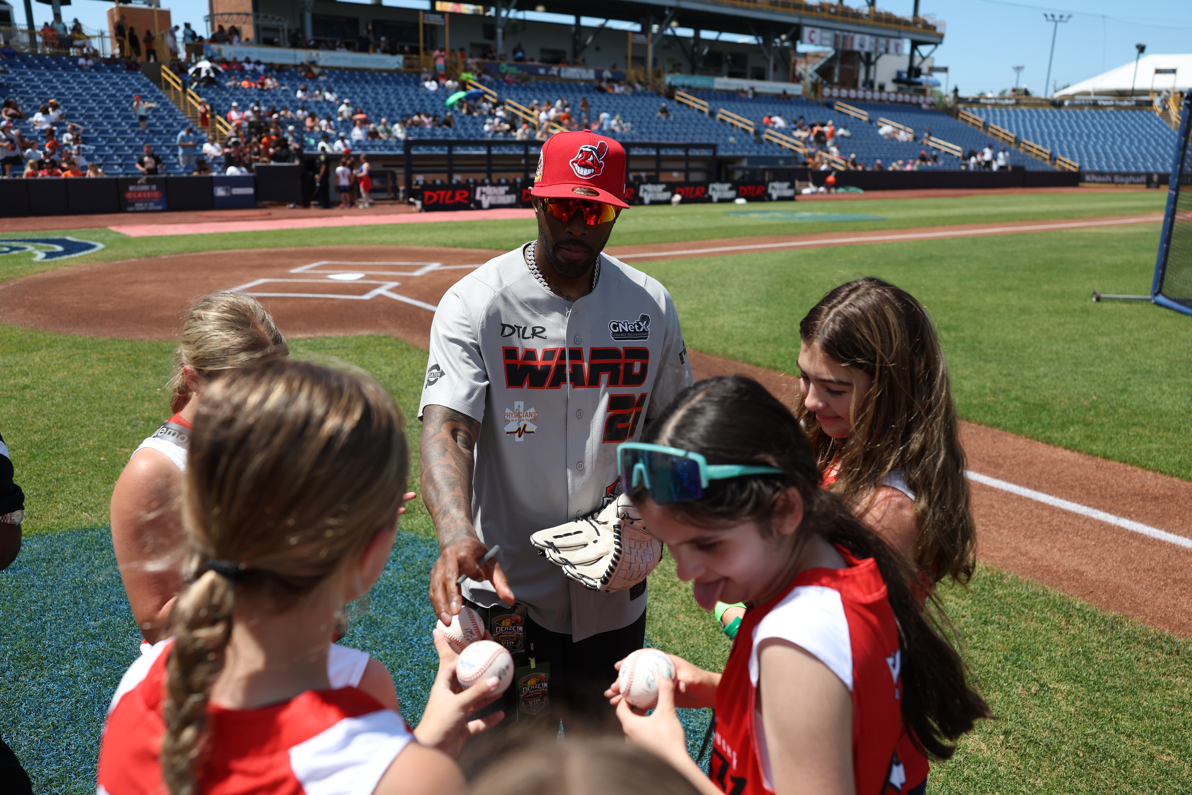 Photos from the Denzel Ward celebrity softball game, June 6,...