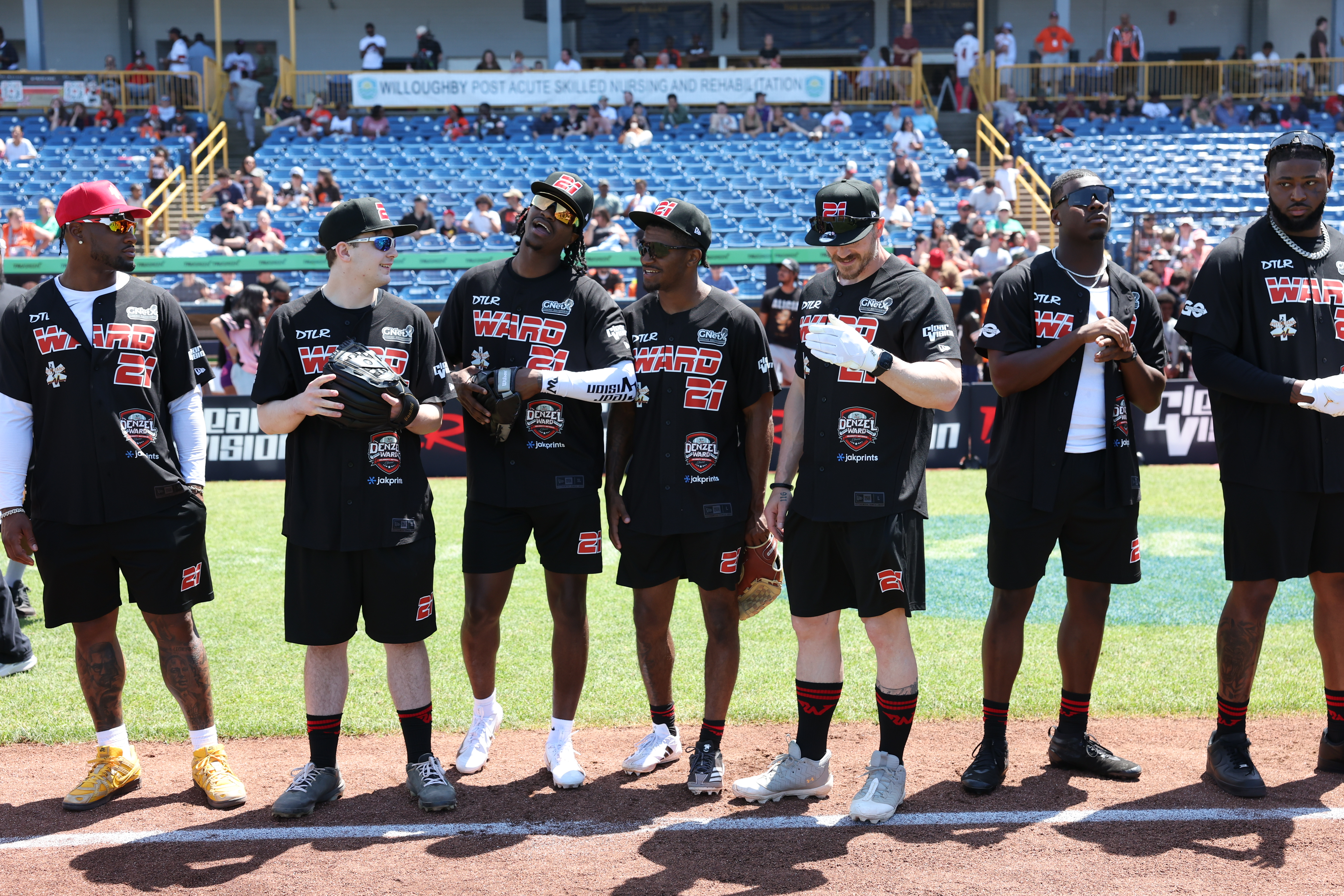 Photos from the Denzel Ward celebrity softball game, June 6,...
