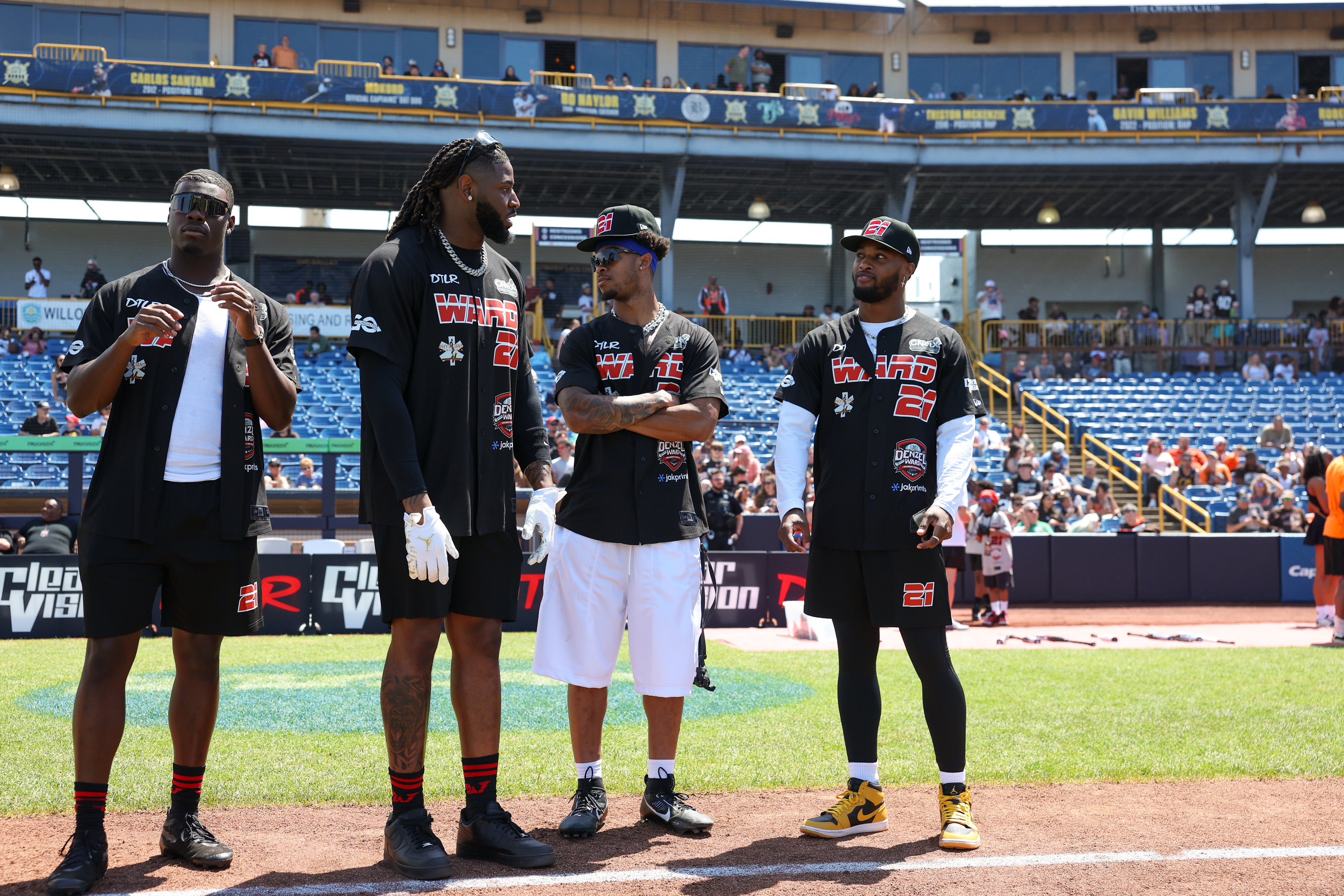 Photos from the Denzel Ward celebrity softball game, June 6,...