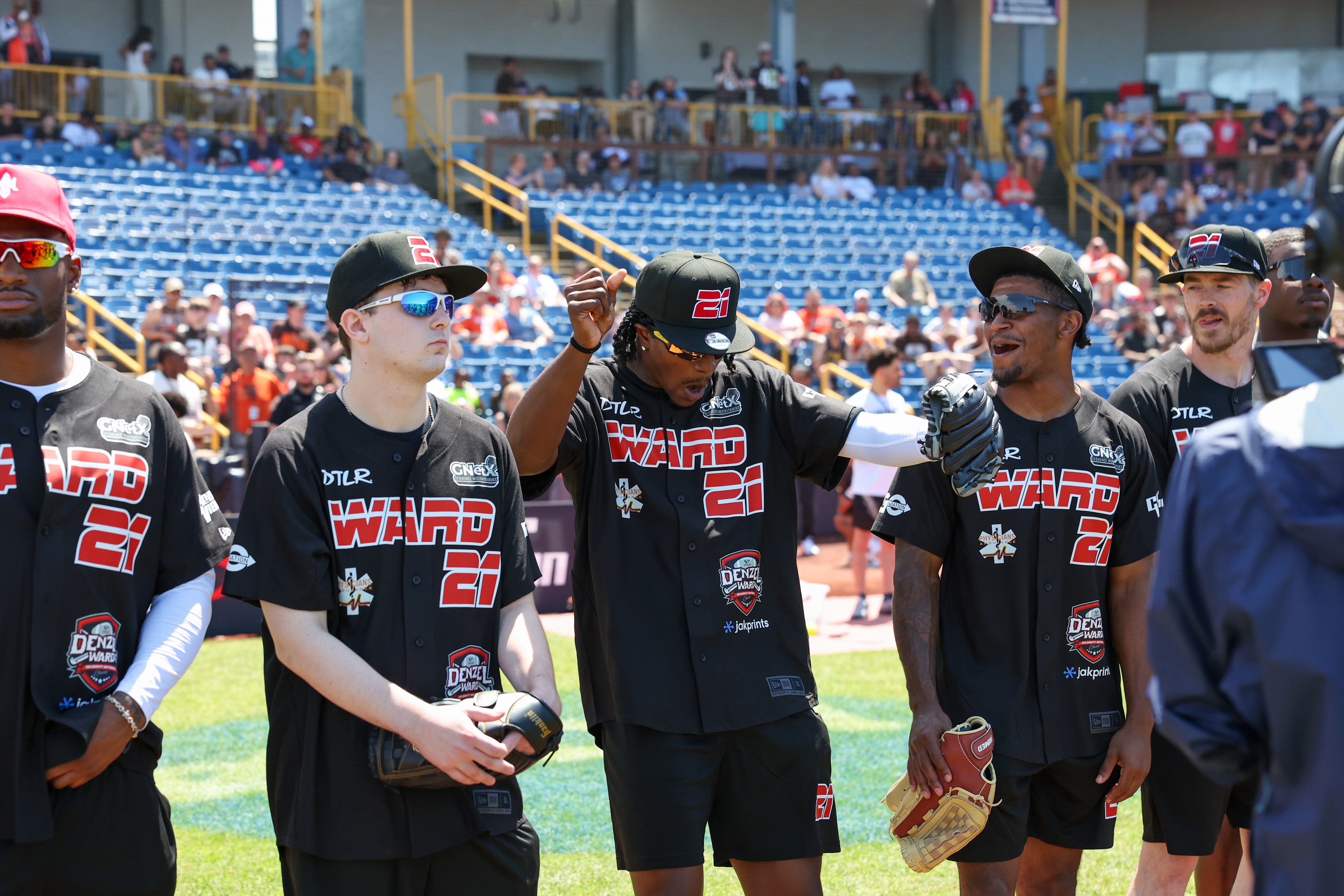 Photos from the Denzel Ward celebrity softball game, June 6,...