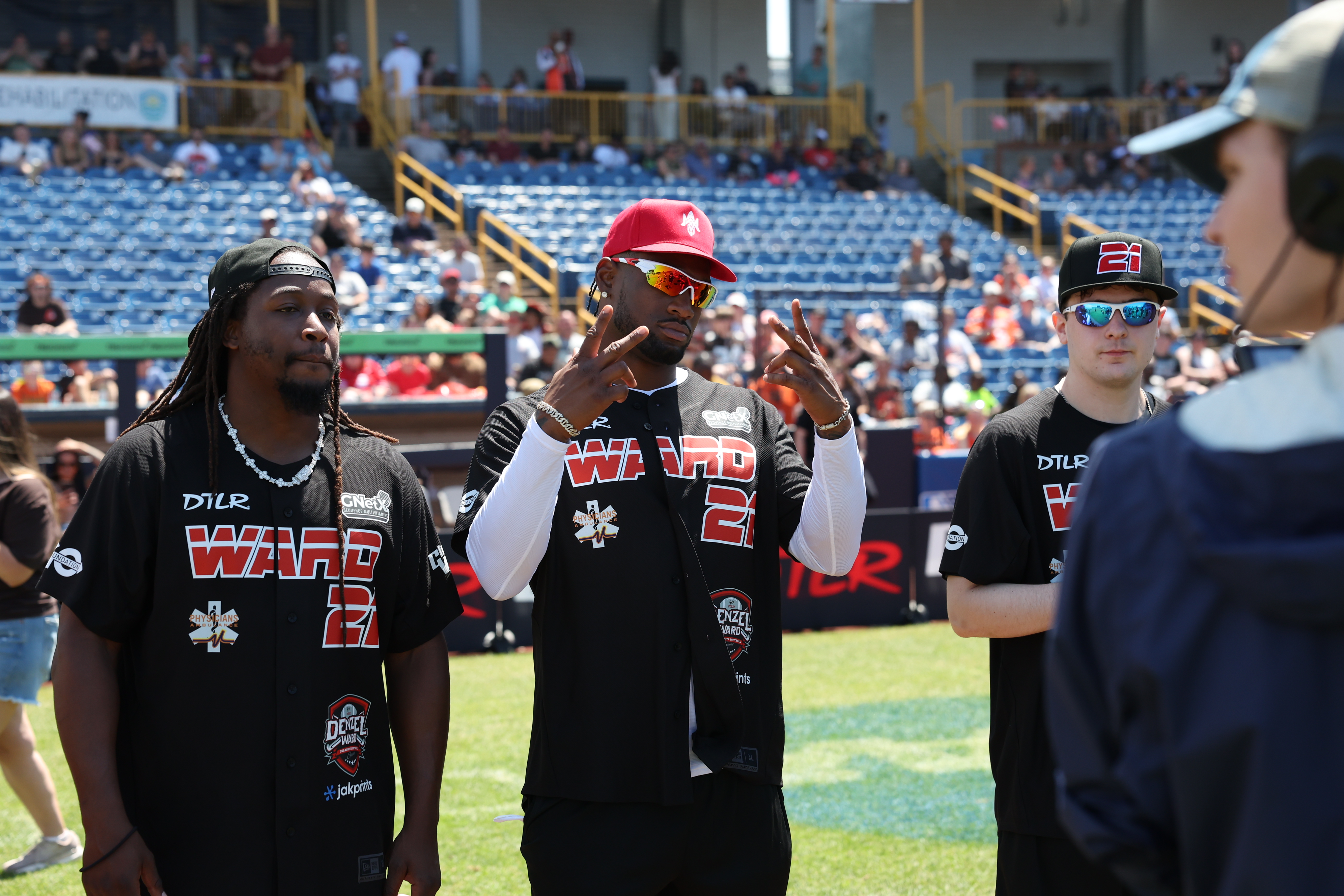 Photos from the Denzel Ward celebrity softball game, June 6,...