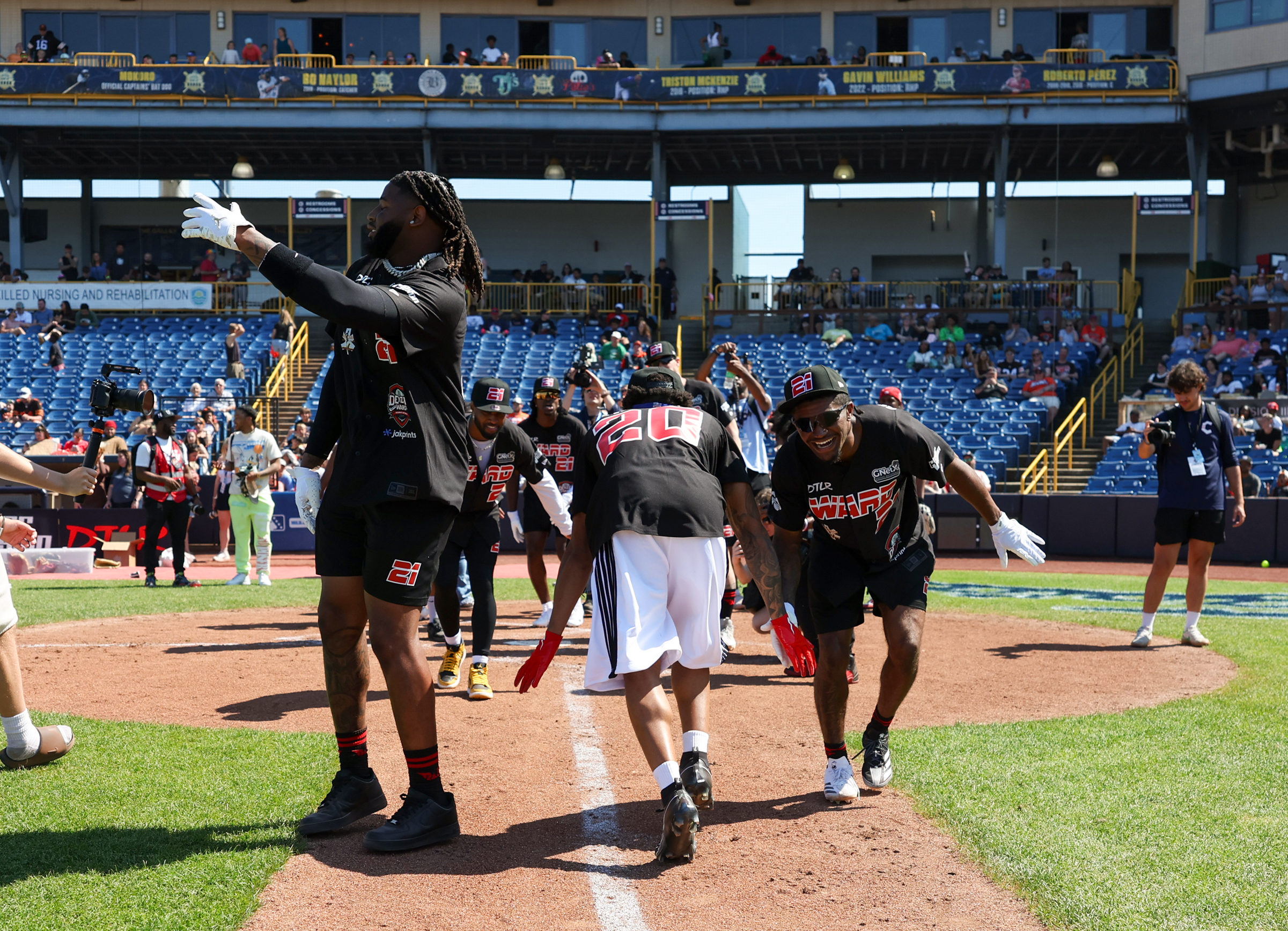 Photos from the Denzel Ward celebrity softball game, June 6,...