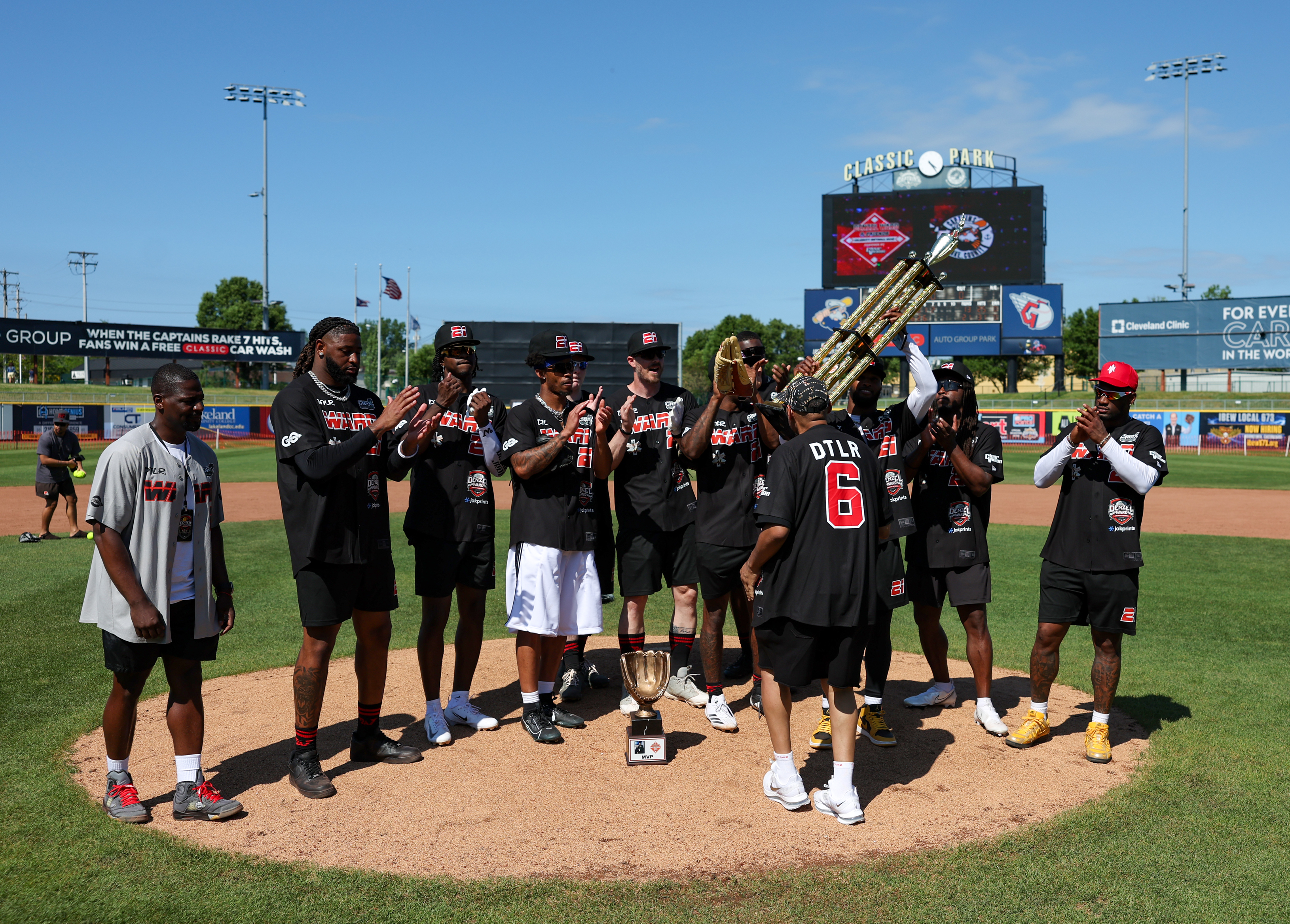 Photos from the Denzel Ward celebrity softball game, June 6,...