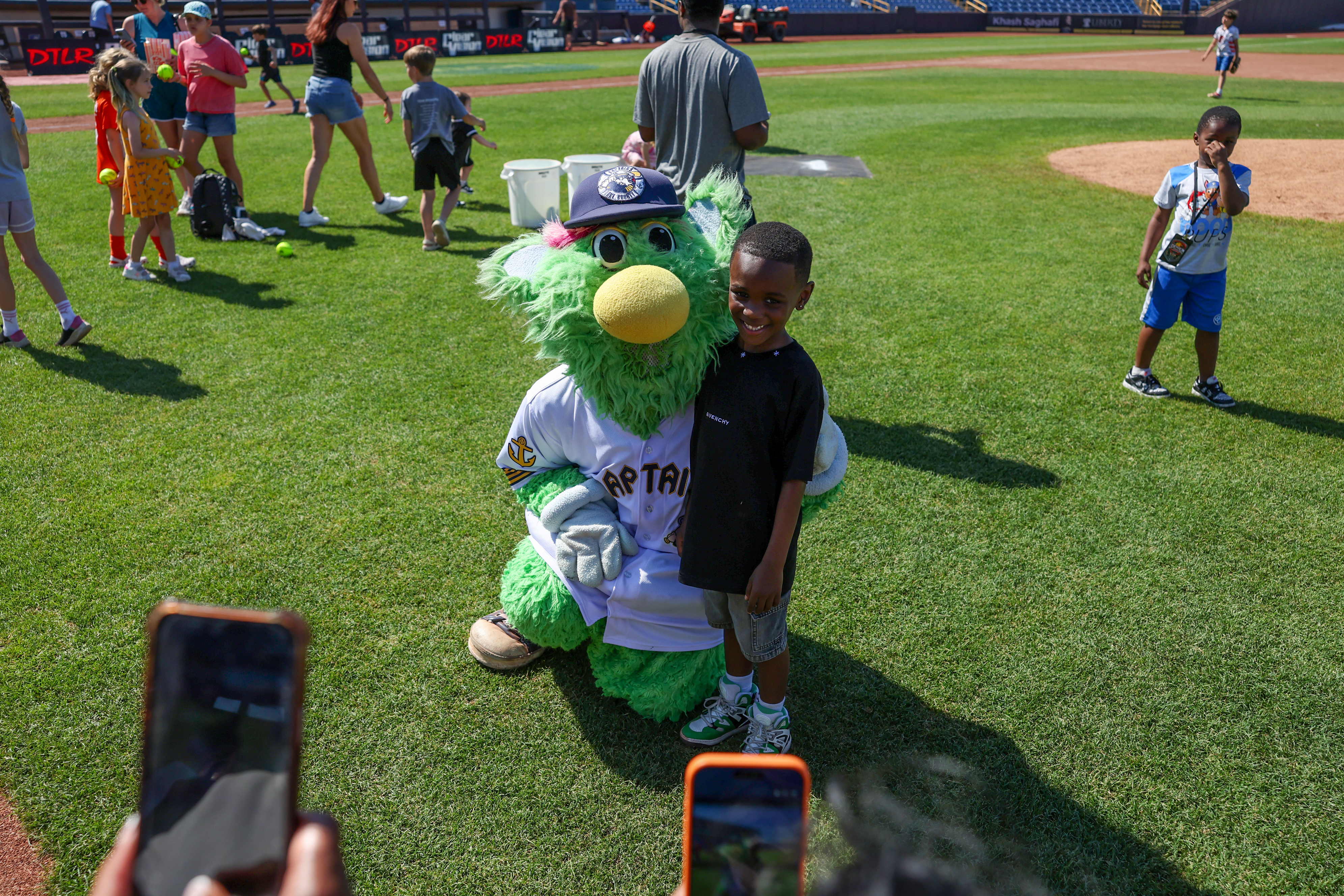 Photos from the Denzel Ward celebrity softball game, June 6,...
