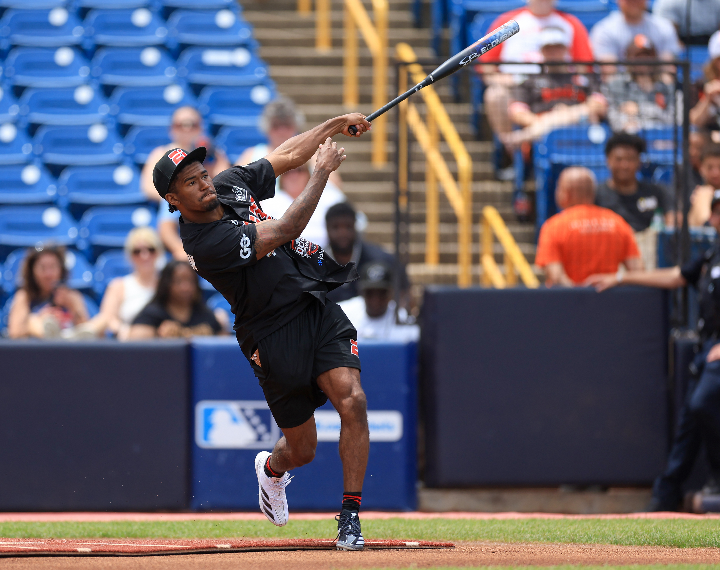 Photos from the Denzel Ward celebrity softball game, June 6,...
