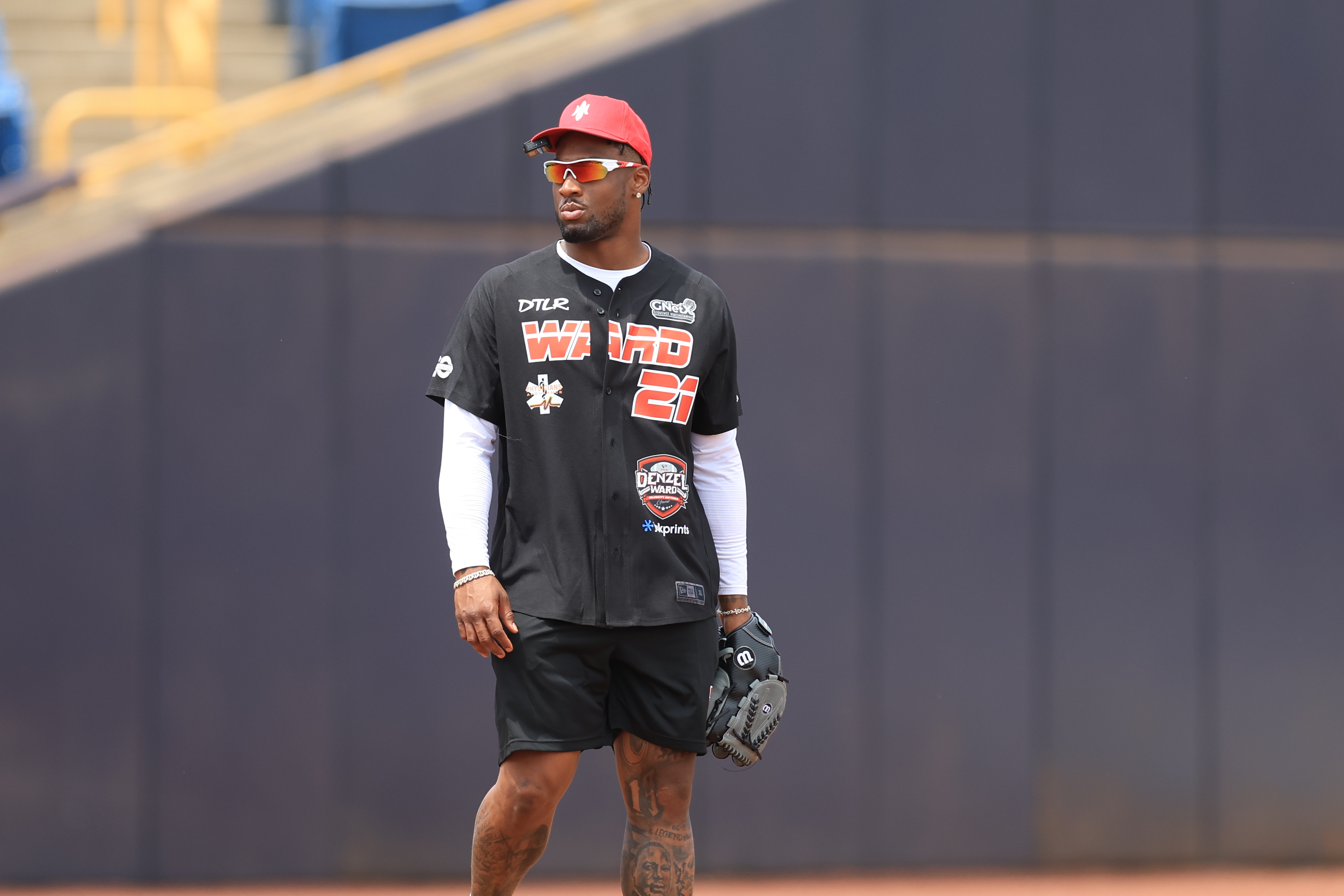 Photos from the Denzel Ward celebrity softball game, June 6,...