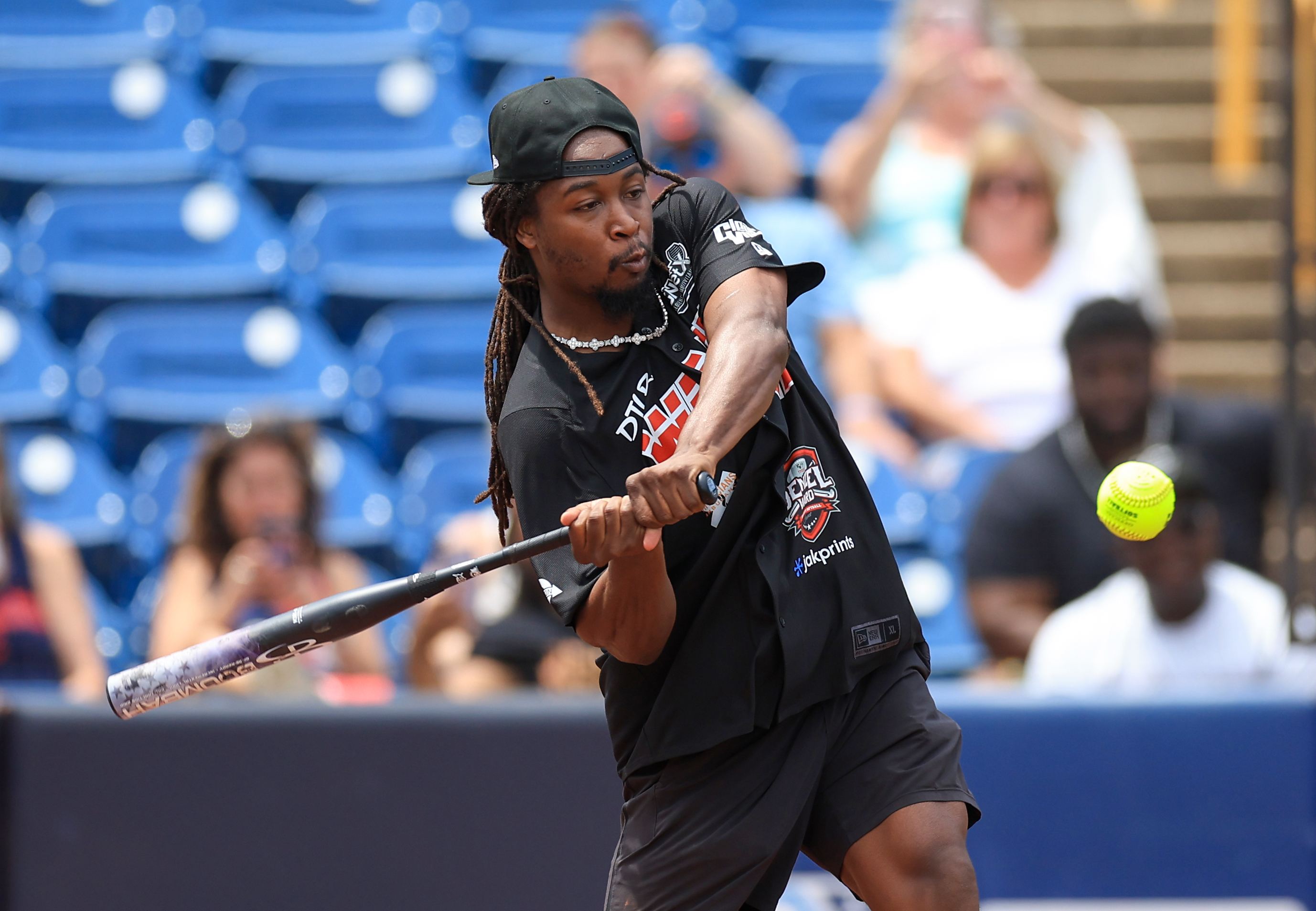 Photos from the Denzel Ward celebrity softball game, June 6,...