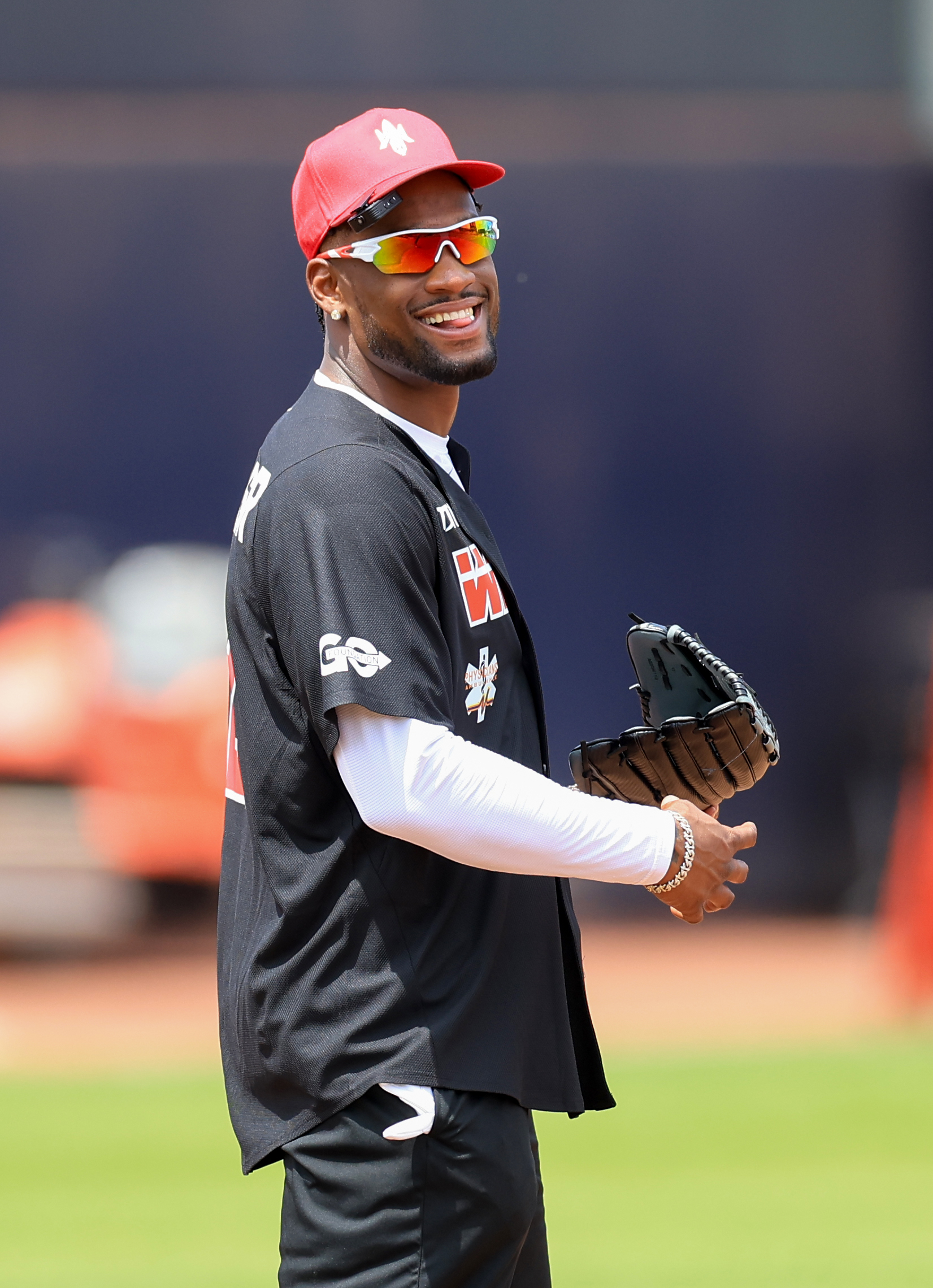 Photos from the Denzel Ward celebrity softball game, June 6,...