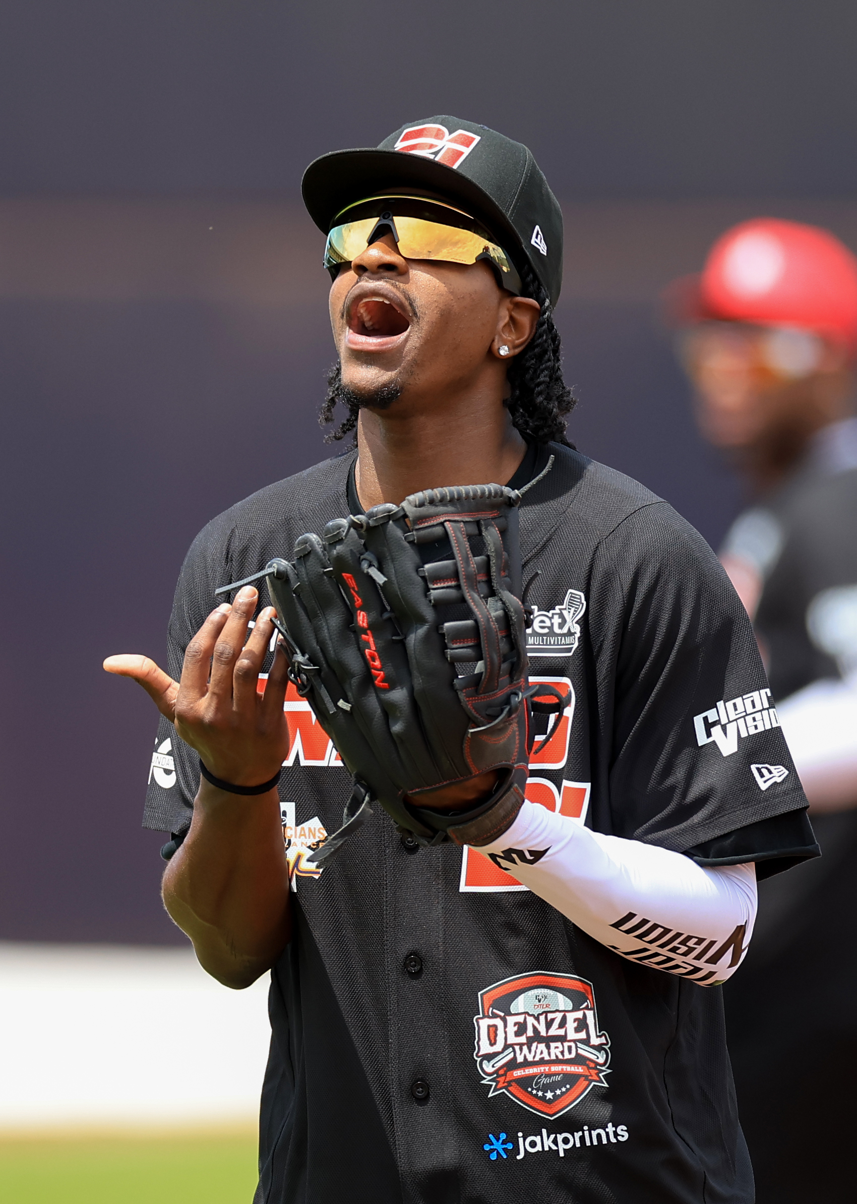 Photos from the Denzel Ward celebrity softball game, June 6,...