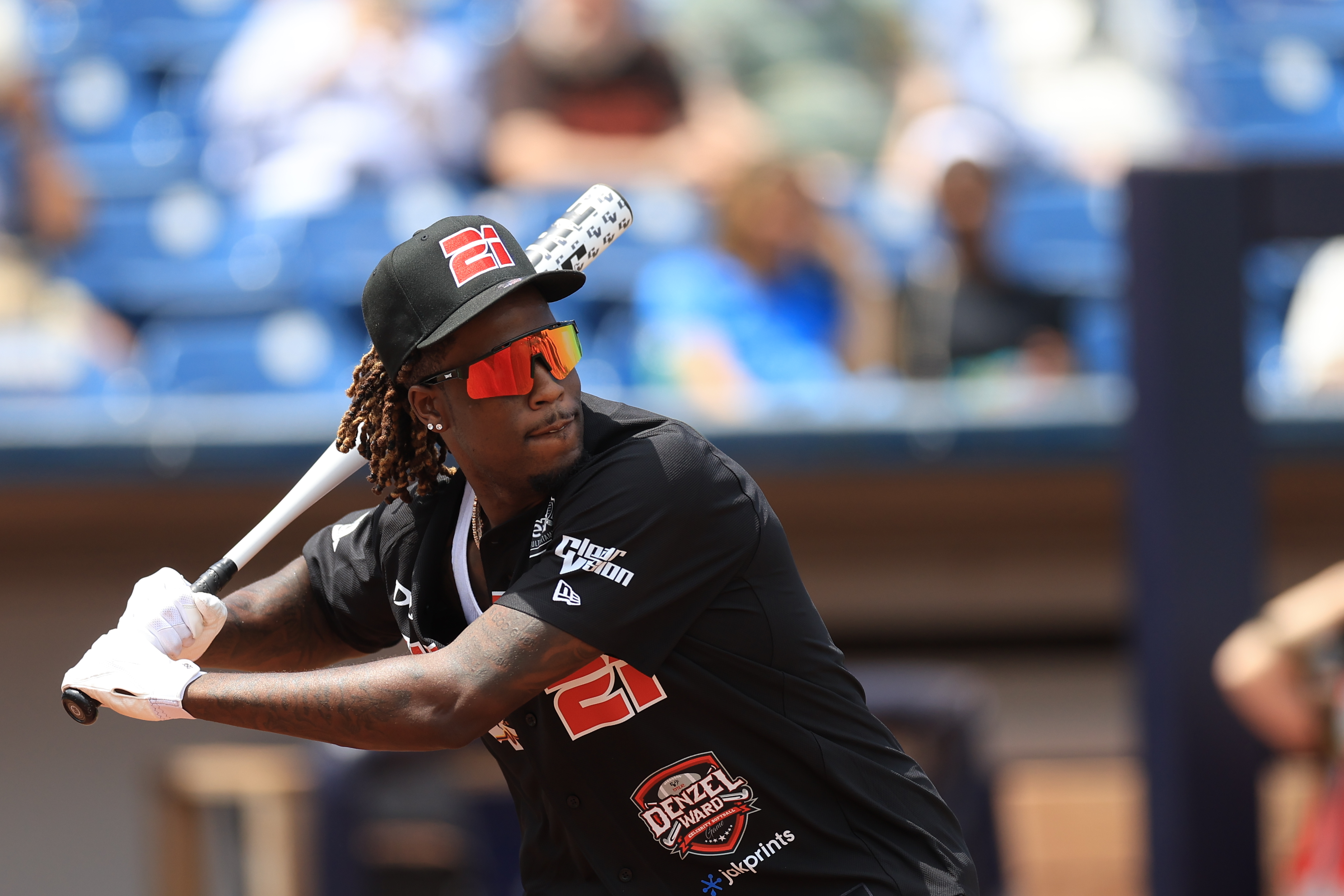 Photos from the Denzel Ward celebrity softball game, June 6,...