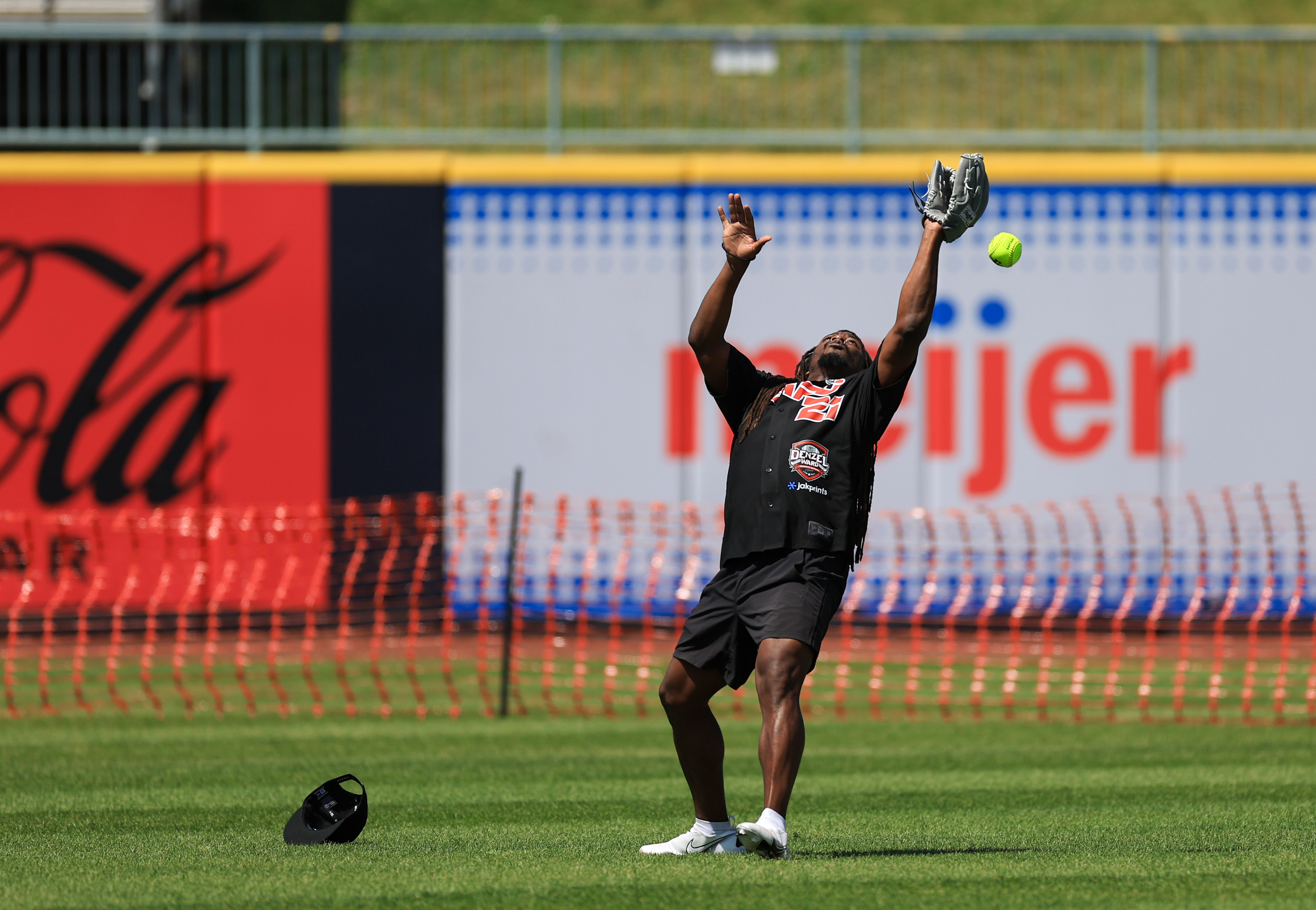 Photos from the Denzel Ward celebrity softball game, June 6,...