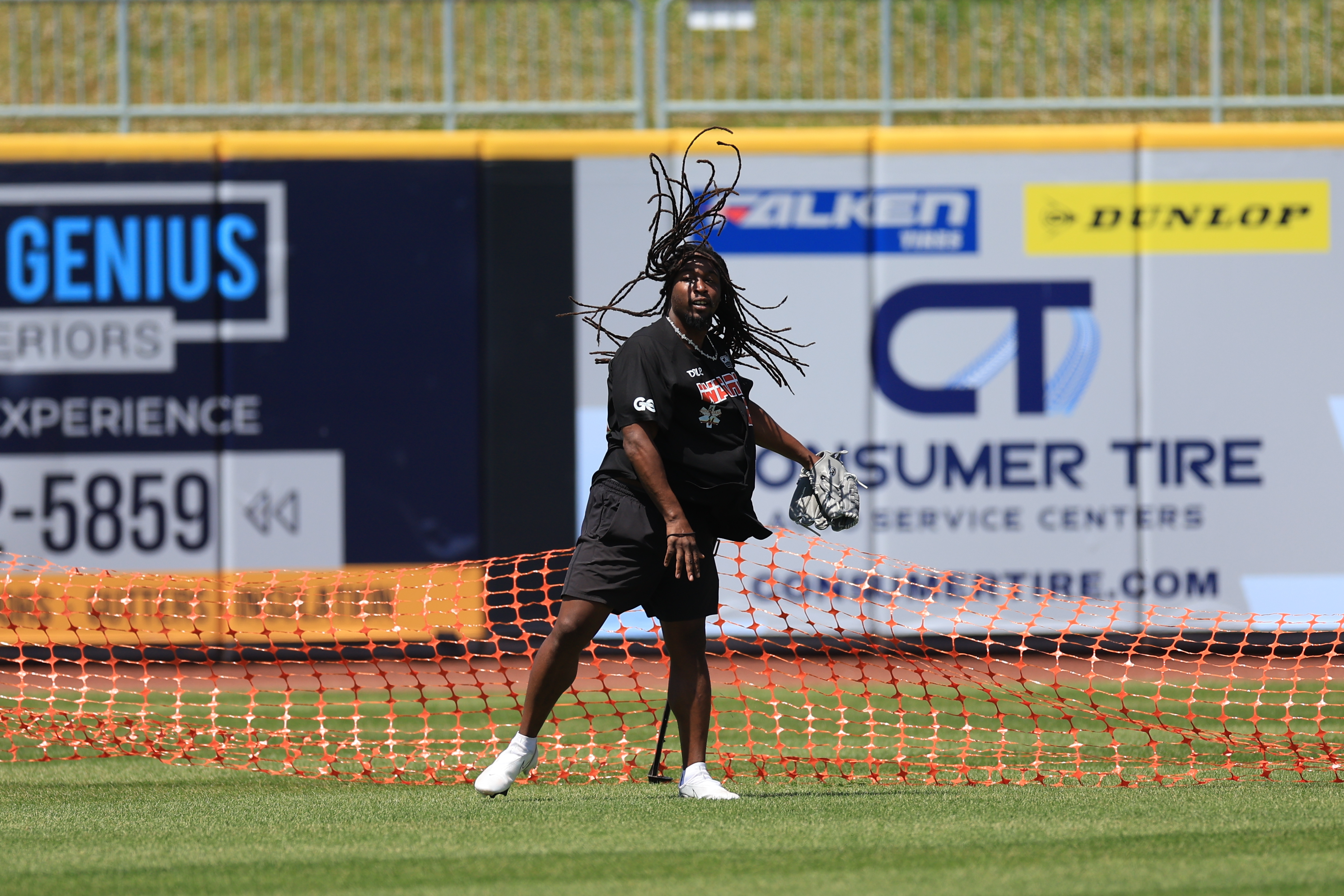 Photos from the Denzel Ward celebrity softball game, June 6,...