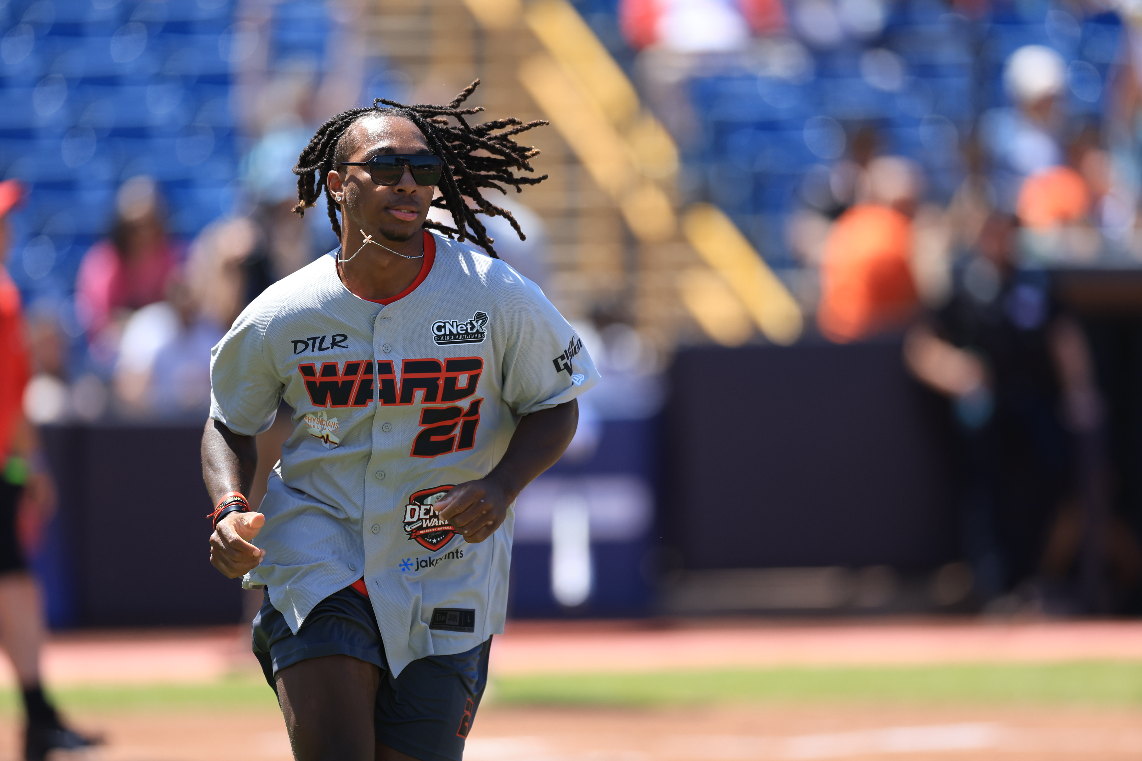 Photos from the Denzel Ward celebrity softball game, June 6,...