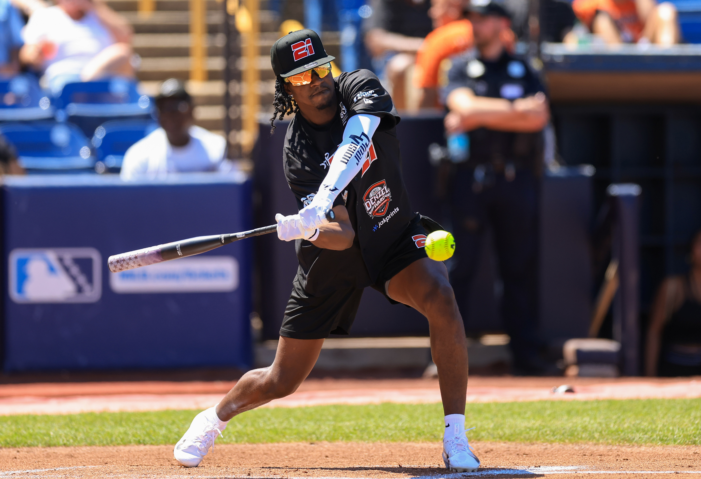 Photos from the Denzel Ward celebrity softball game, June 6,...