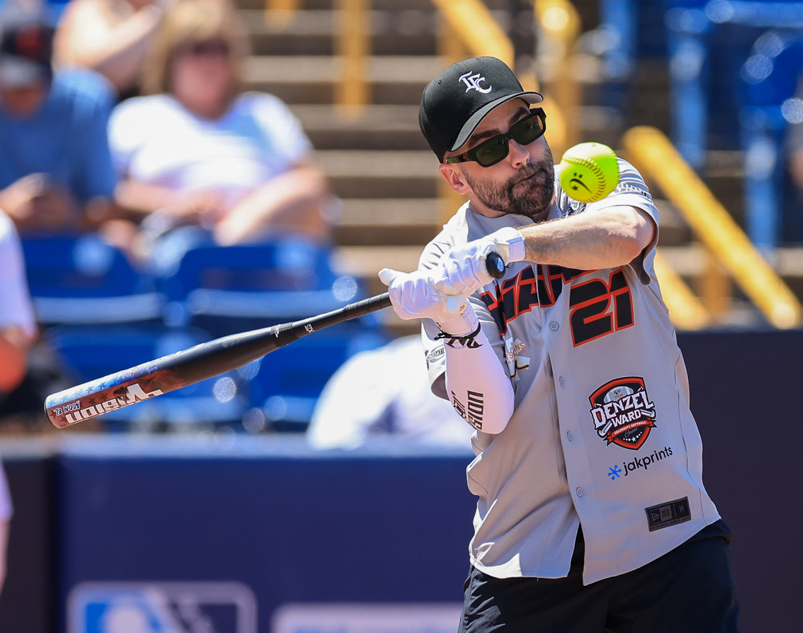 Photos from the Denzel Ward celebrity softball game, June 6,...