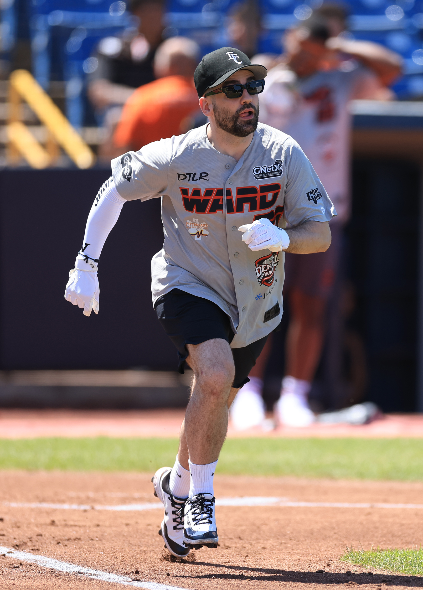 Photos from the Denzel Ward celebrity softball game, June 6,...