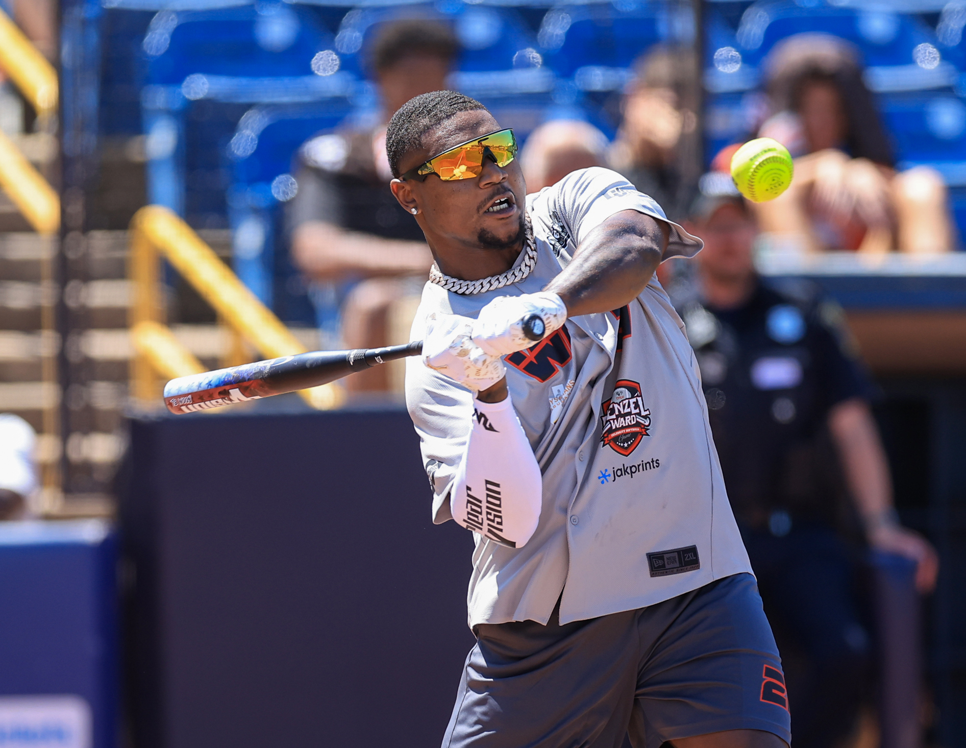 Photos from the Denzel Ward celebrity softball game, June 6,...