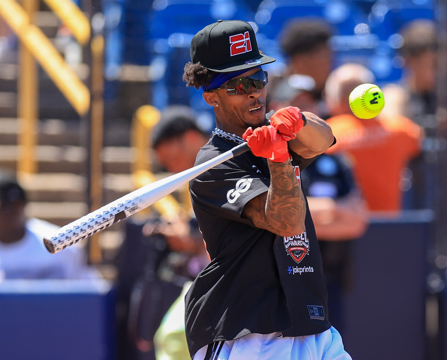Photos from the Denzel Ward celebrity softball game, June 6,...