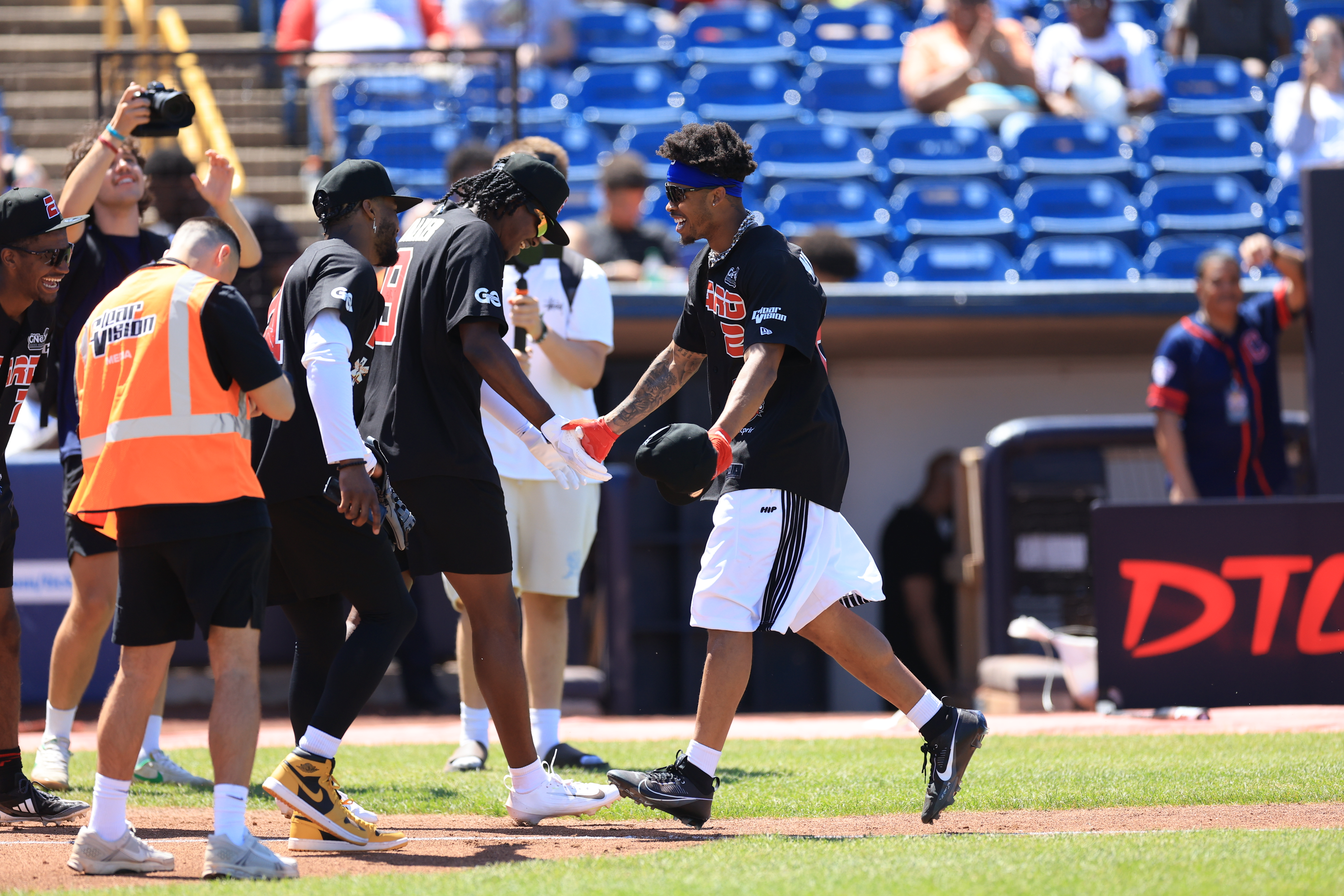 Photos from the Denzel Ward celebrity softball game, June 6,...