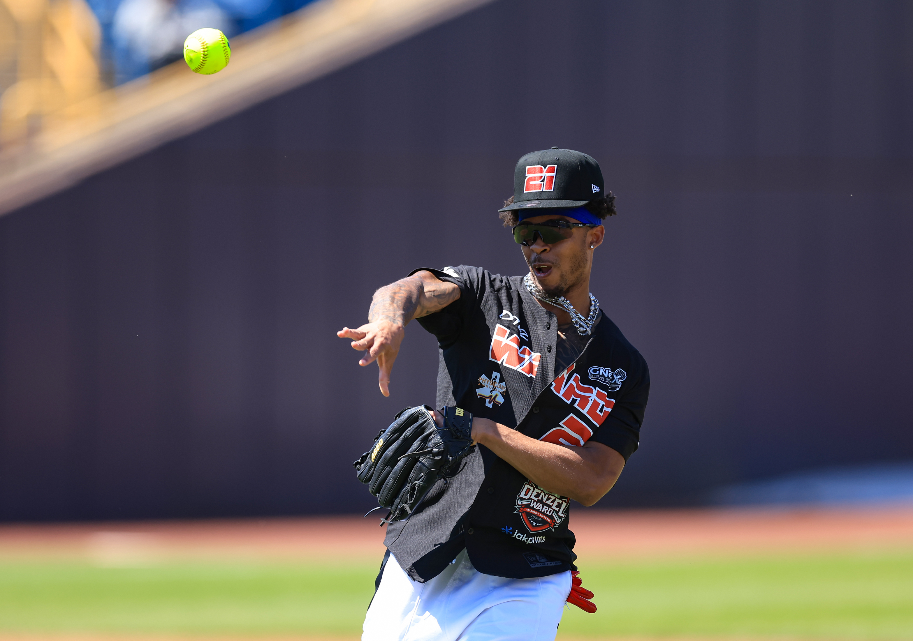 Photos from the Denzel Ward celebrity softball game, June 6,...