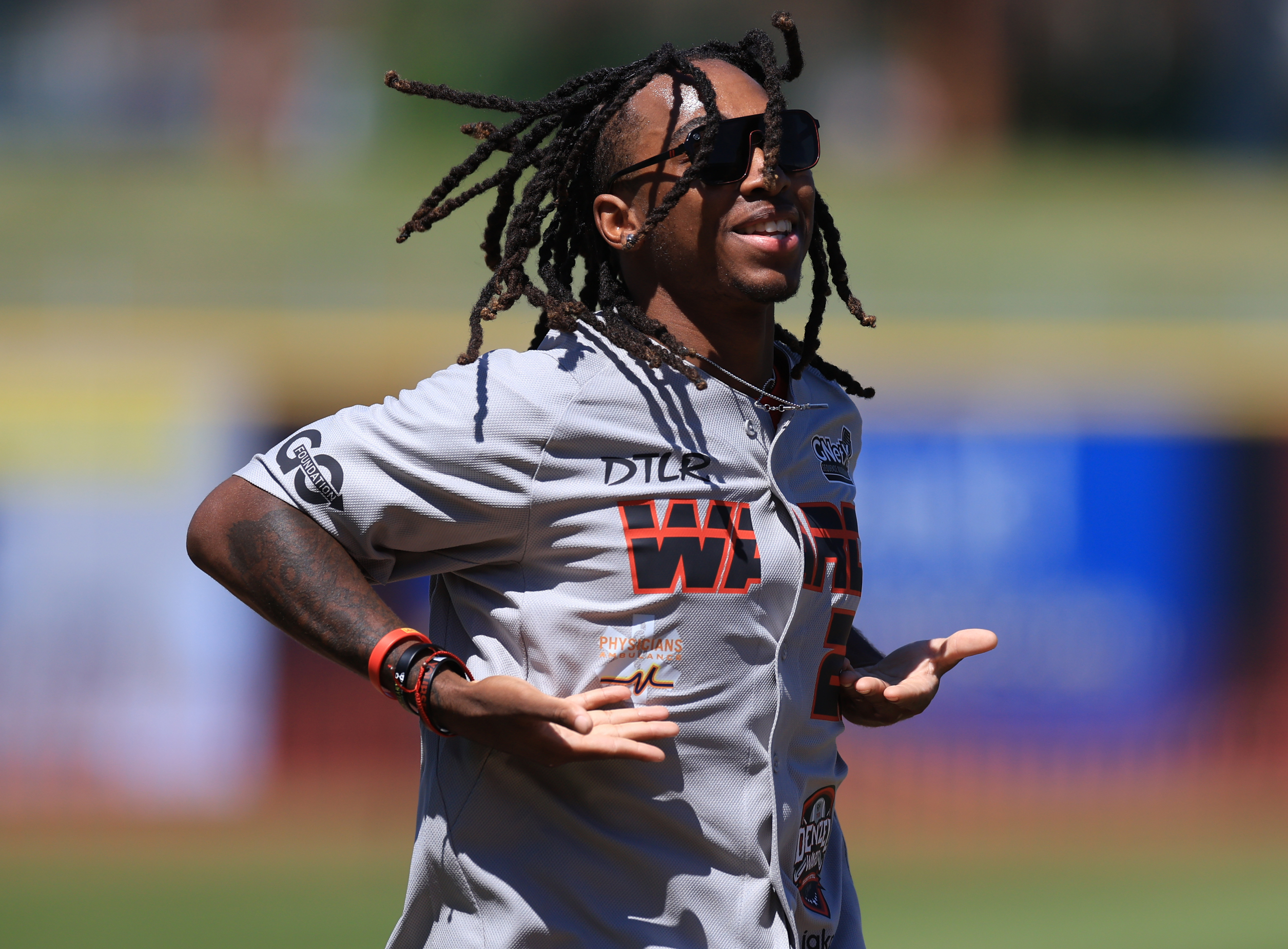 Photos from the Denzel Ward celebrity softball game, June 6,...