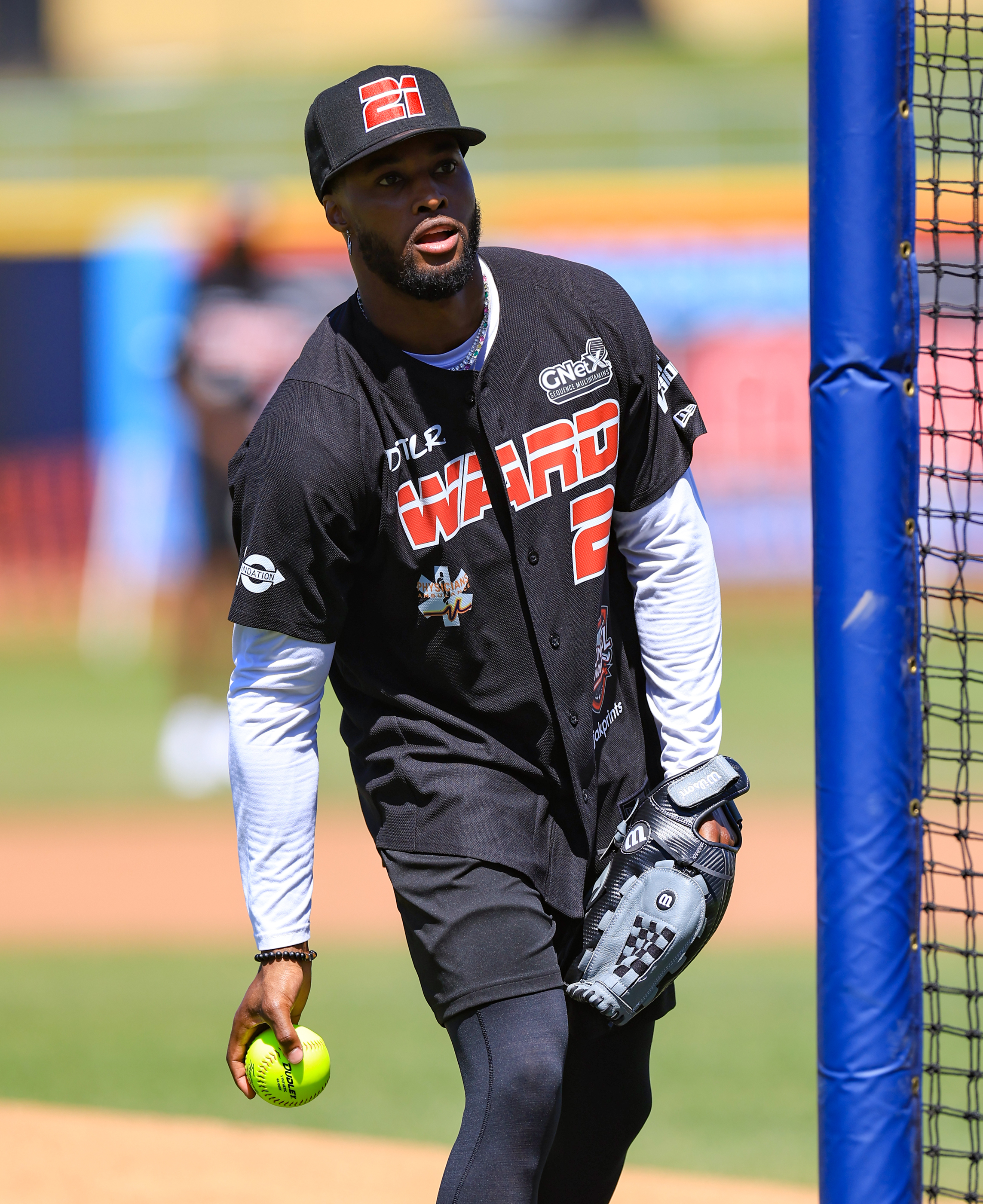 Photos from the Denzel Ward celebrity softball game, June 6,...