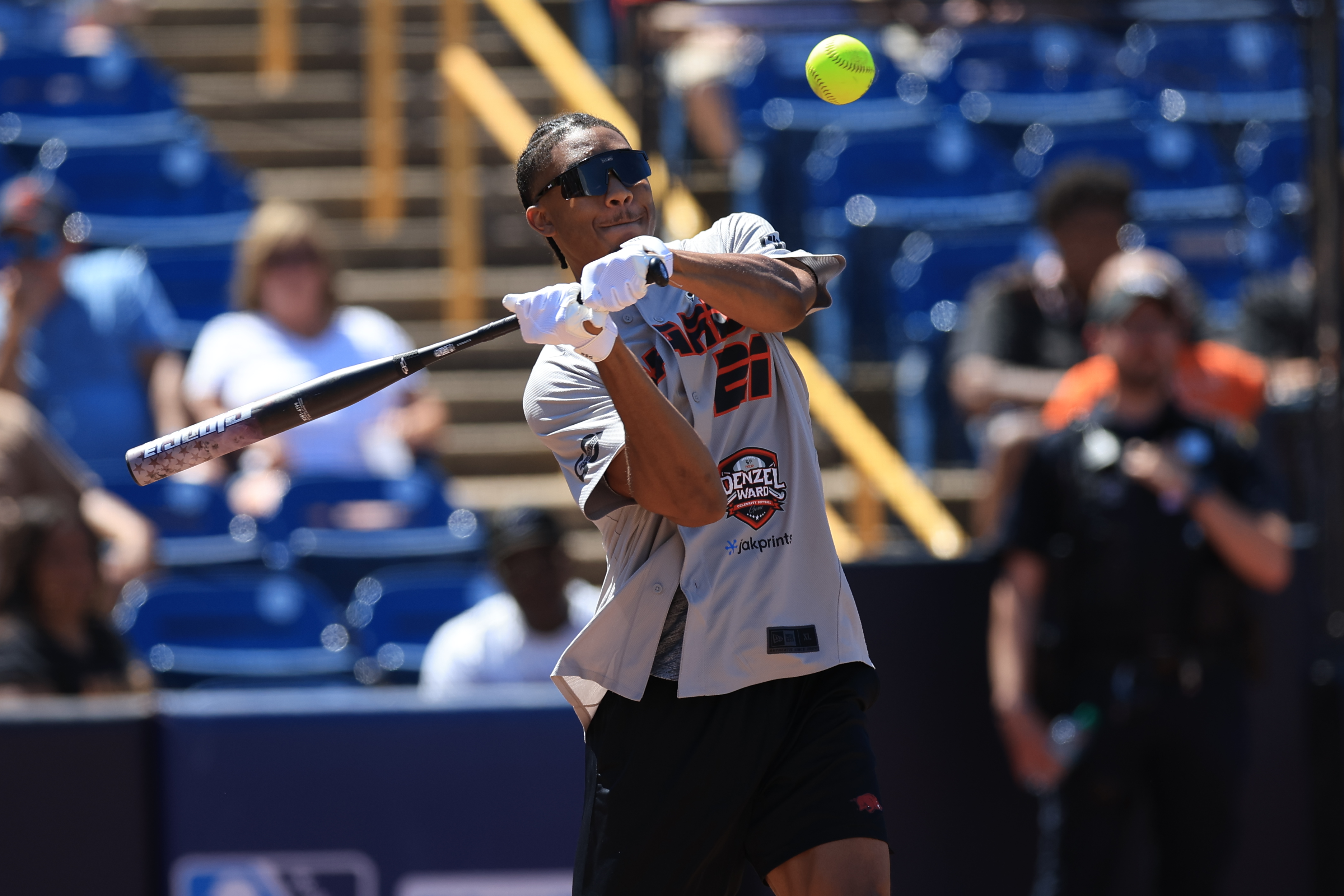 Photos from the Denzel Ward celebrity softball game, June 6,...