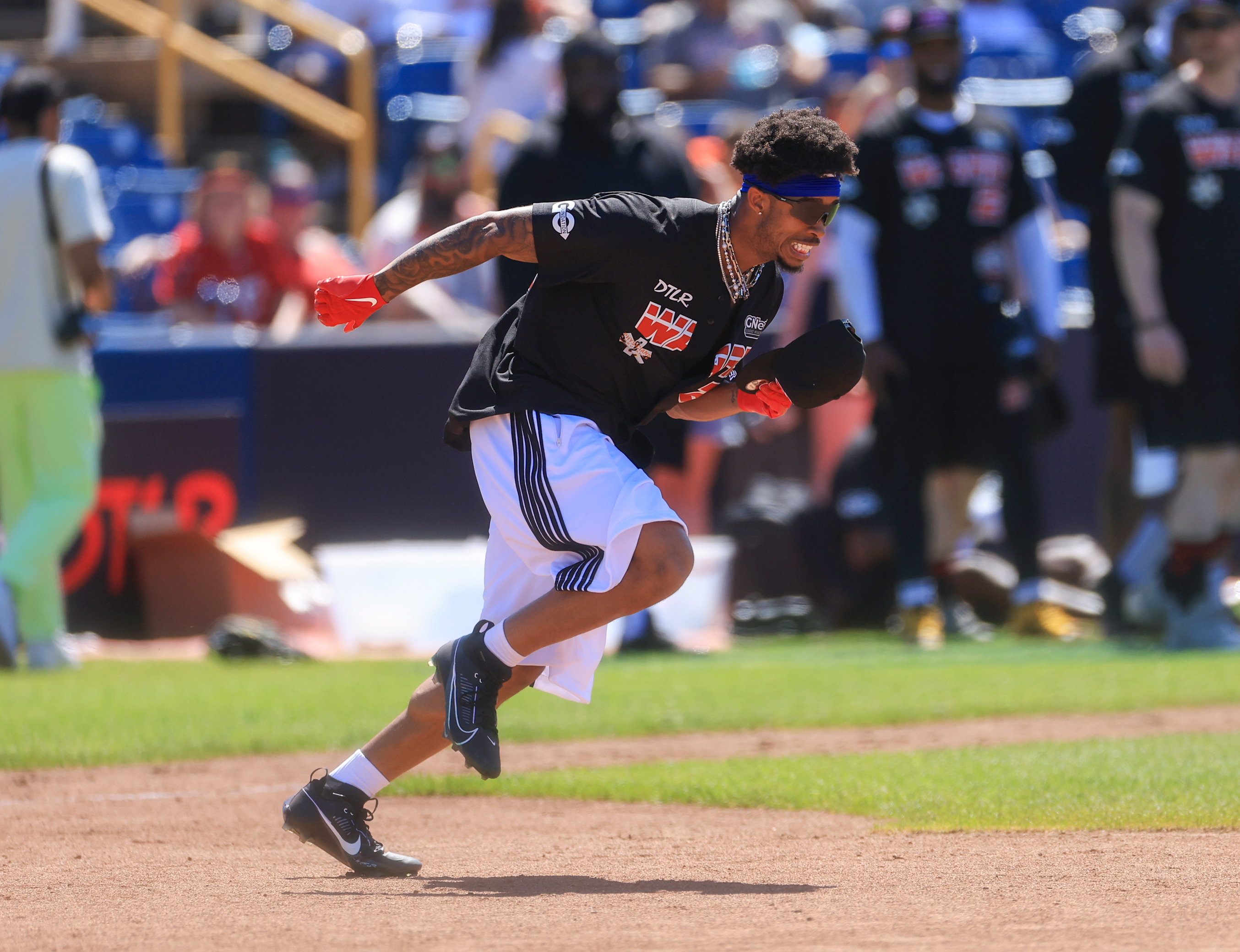 Photos from the Denzel Ward celebrity softball game, June 6,...