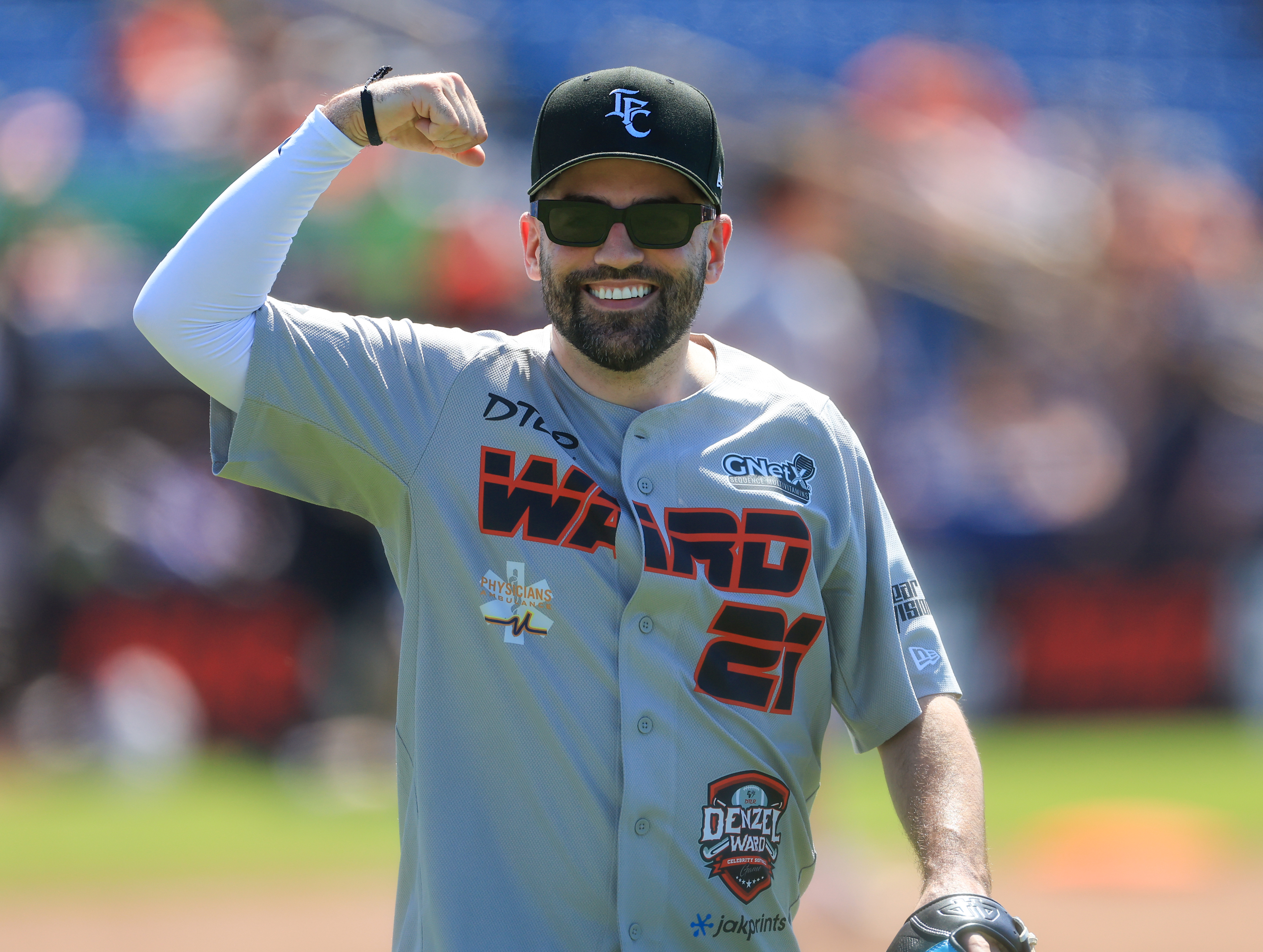 Photos from the Denzel Ward celebrity softball game, June 6,...