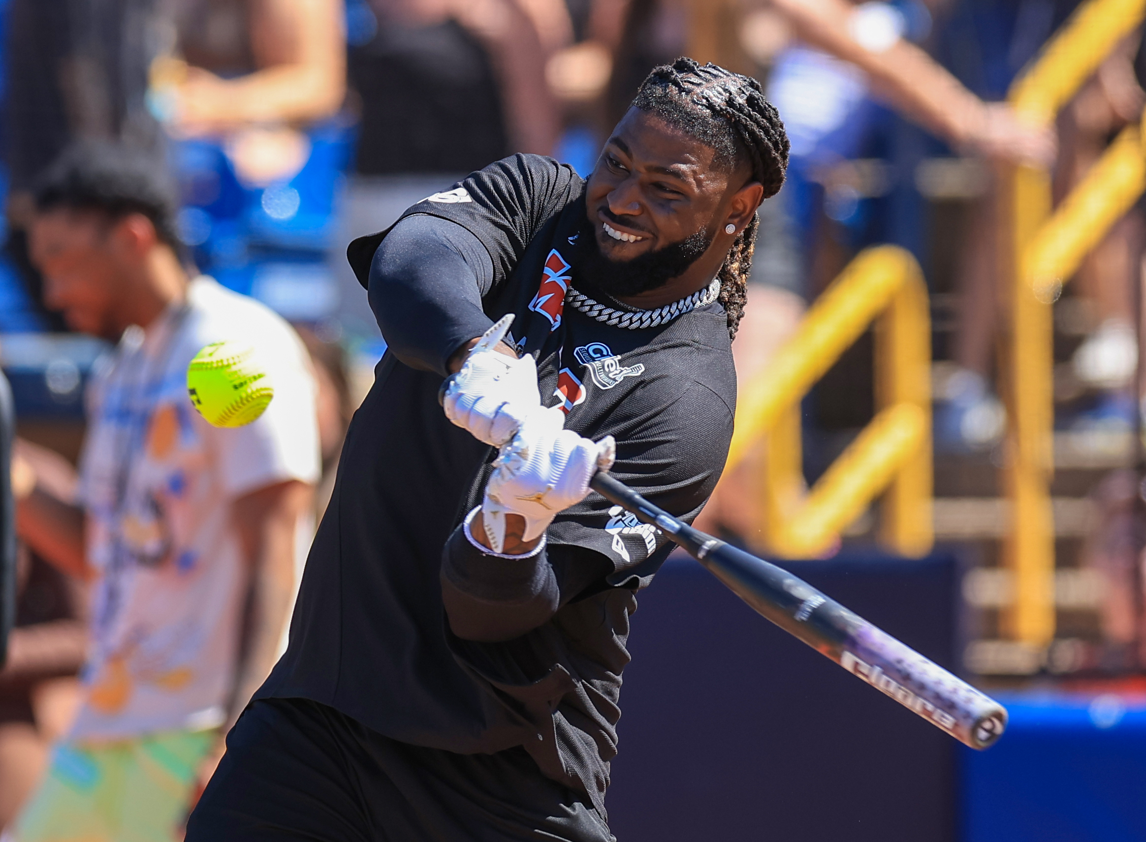 Photos from the Denzel Ward celebrity softball game, June 6,...