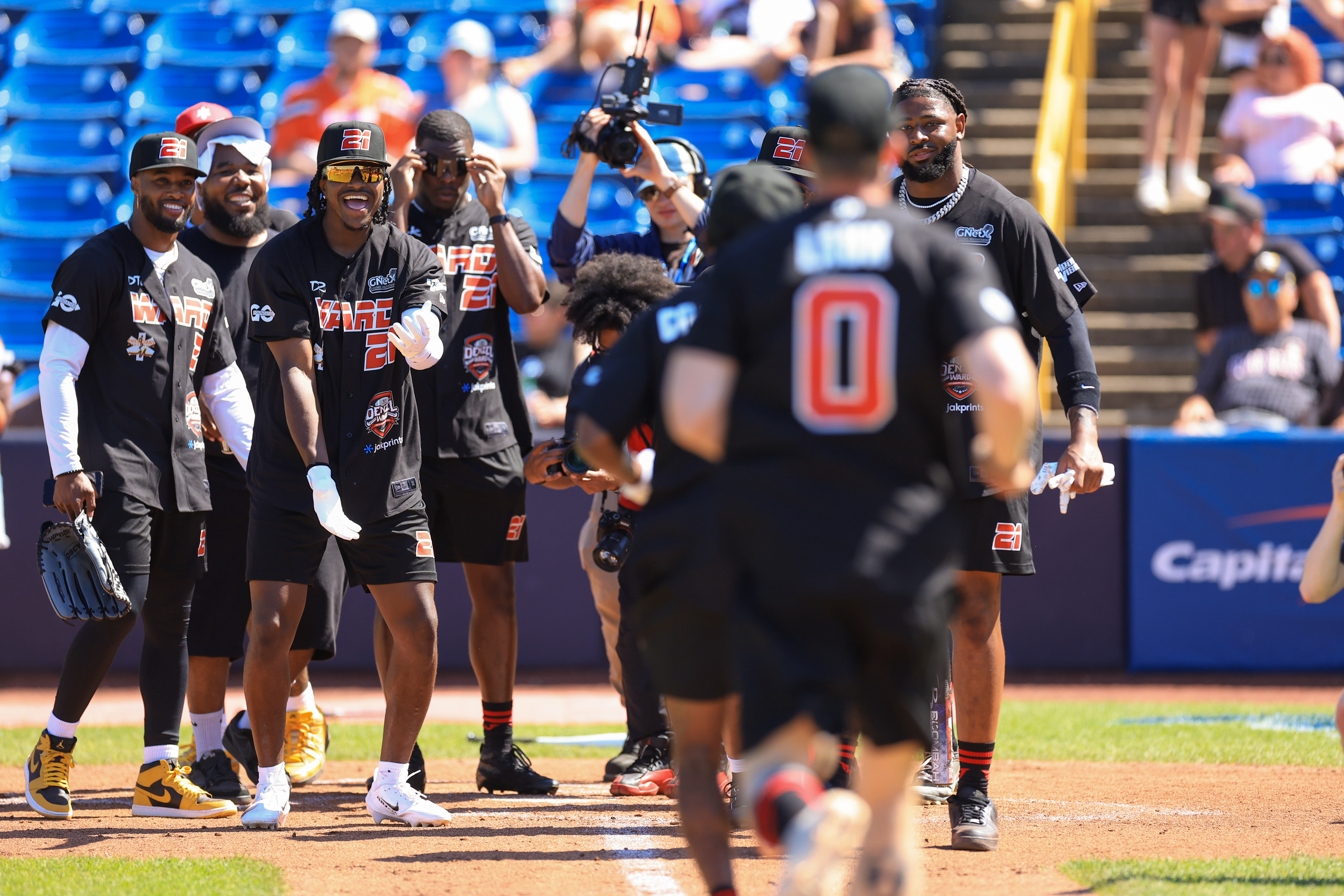Photos from the Denzel Ward celebrity softball game, June 6,...