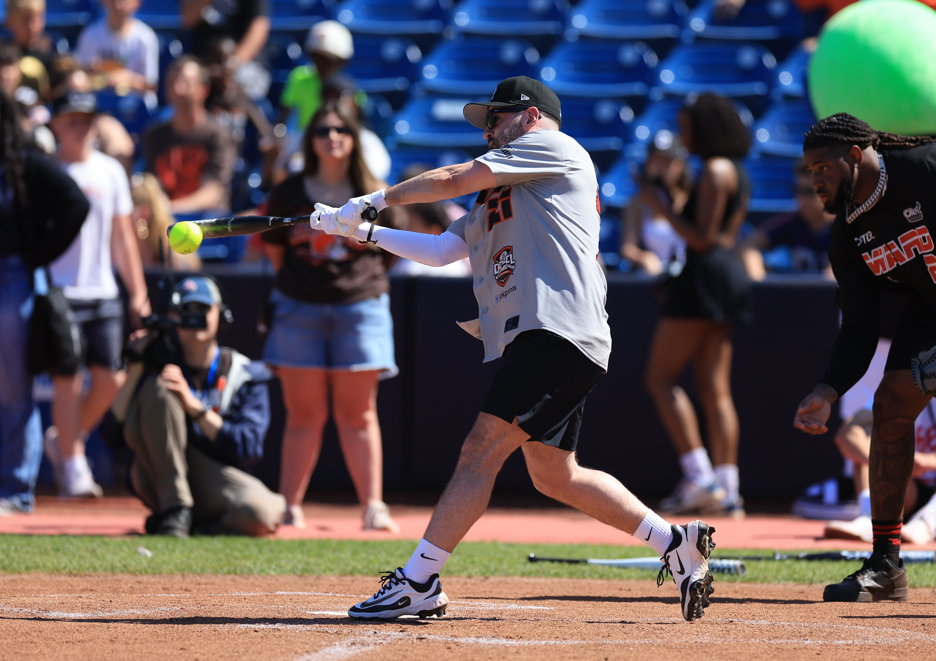 Photos from the Denzel Ward celebrity softball game, June 6,...