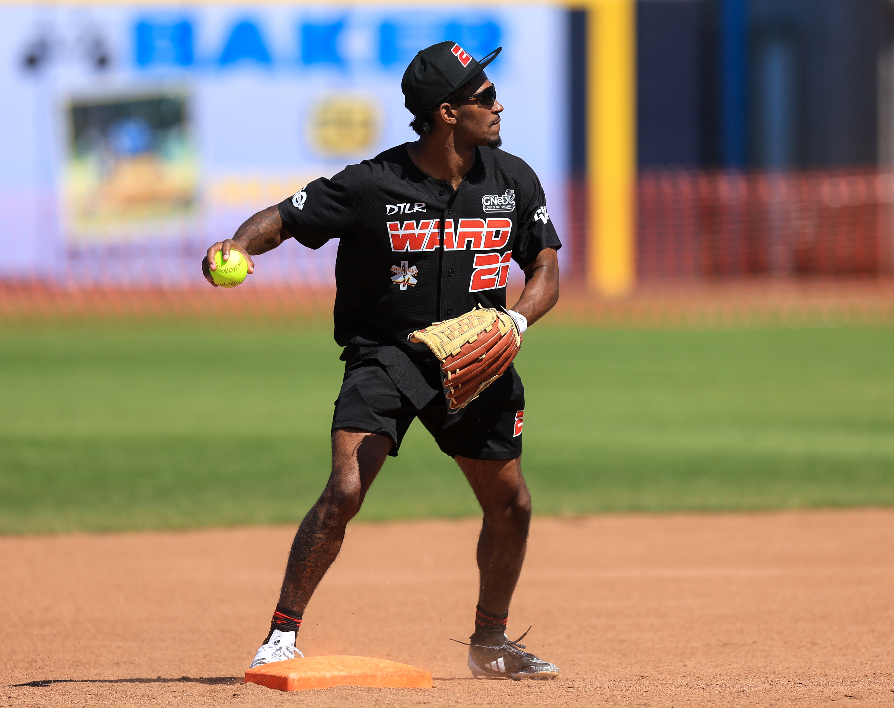 Photos from the Denzel Ward celebrity softball game, June 6,...