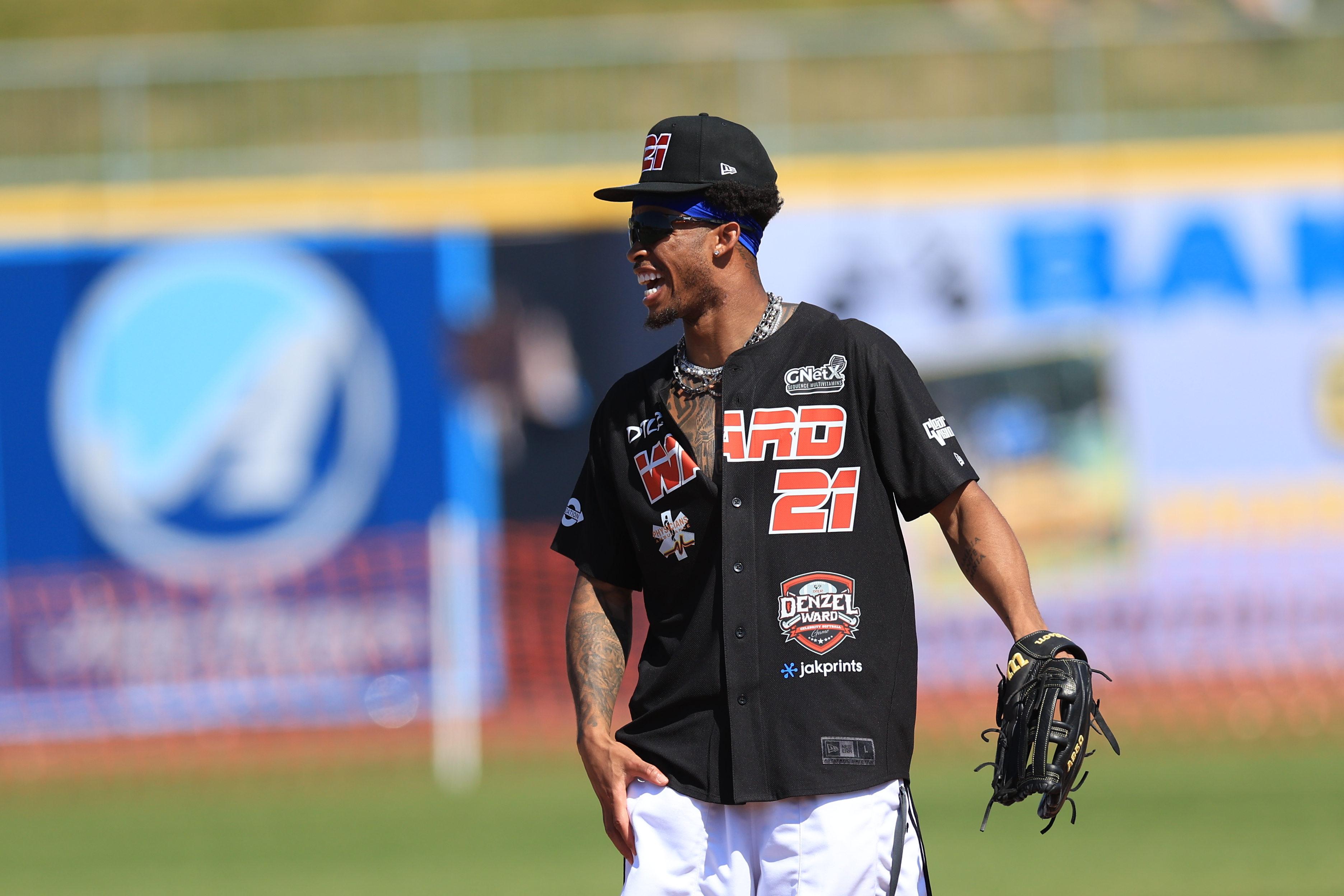 Photos from the Denzel Ward celebrity softball game, June 6,...
