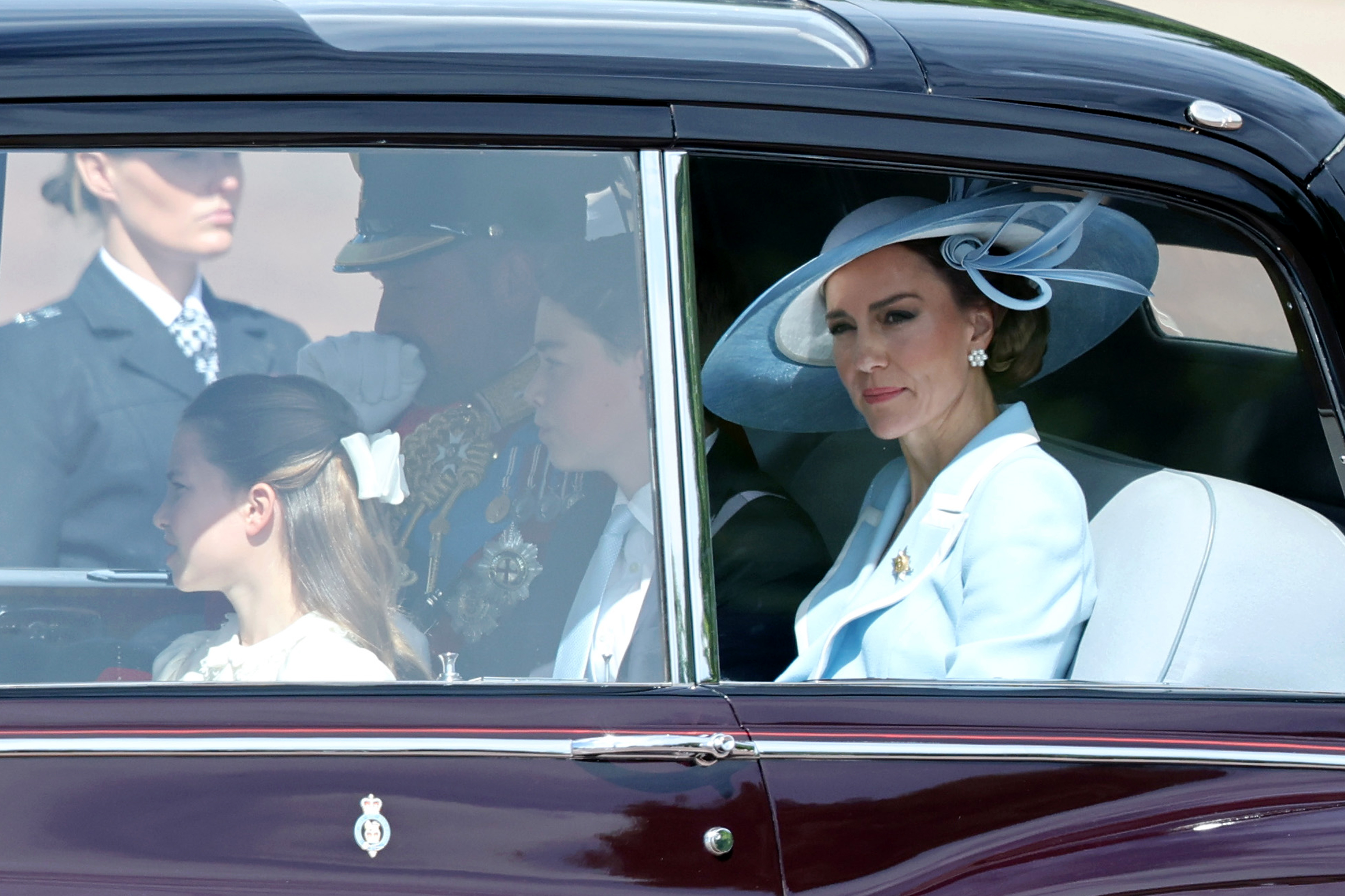 Princess Kate wears a baby blue dress for Trooping the Colour 2026, along with an oversize hat, and her son Prince George wears a matching blue tie