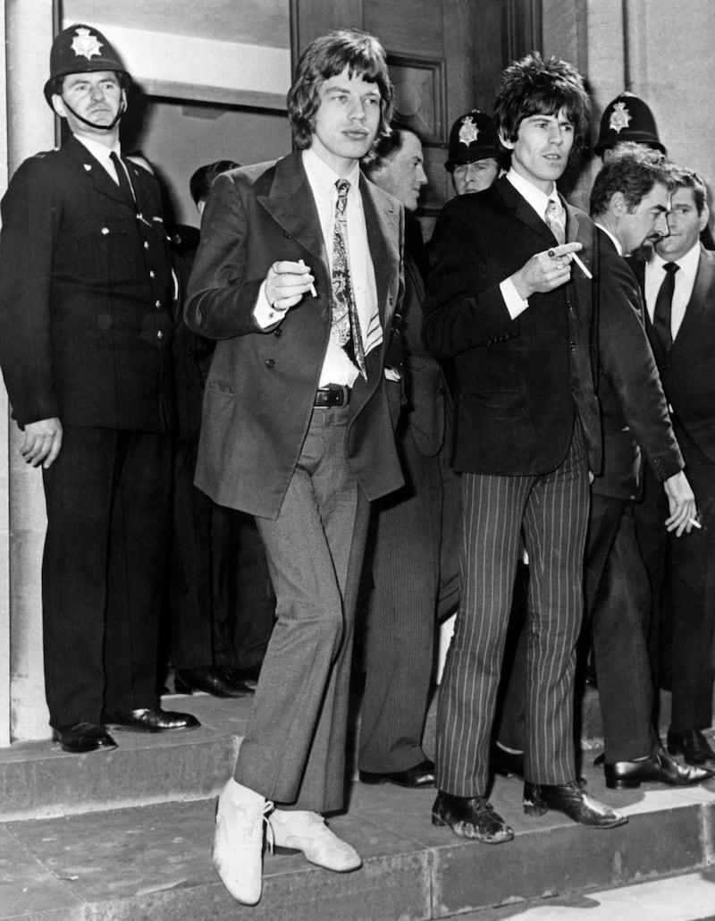 Mick Jagger and The Rolling Stones guitarist Keith Richards leave the court in Chichester on May 11, 1967, after being charged with illegal possession of drugs.